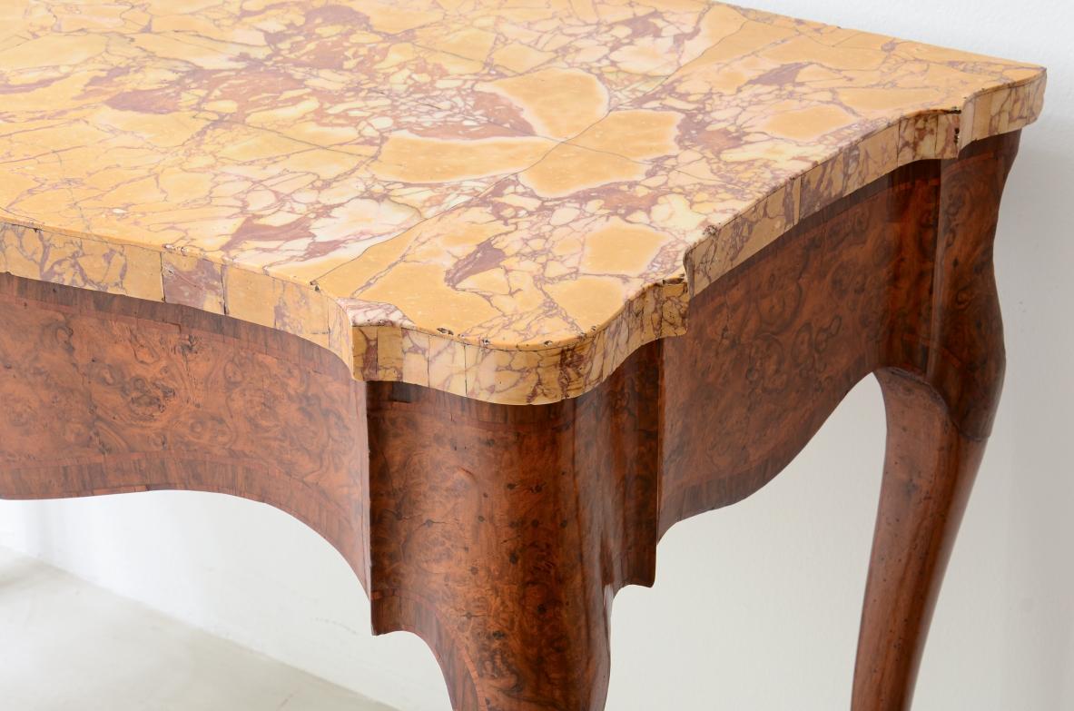 COD-2575
Pair of important consoles in walnut burl with wavy band and turned legs. Top veneered in ancient yellow marble of Roman origin.
Very modern and slender pieces with a terrific marble work top.

Manufacture around 1750

120 x 65 h 93 cm