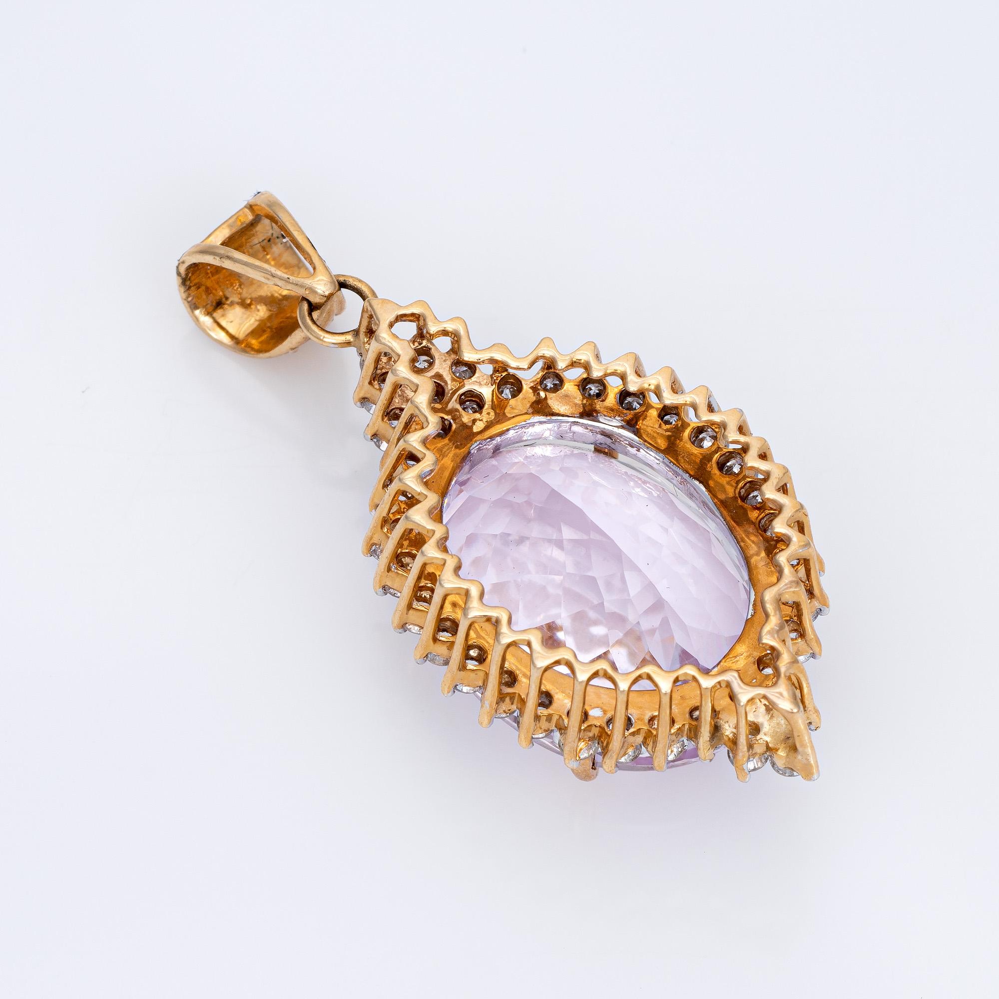 Finely detailed vintage kunzite & diamond pendant crafted in 14 karat yellow gold (circa 1980s to 1990s). 

Oval faceted kunzite is estimated at 17.50 carats (in very good condition and free of cracks or chips). 38 round brilliant cut diamonds are