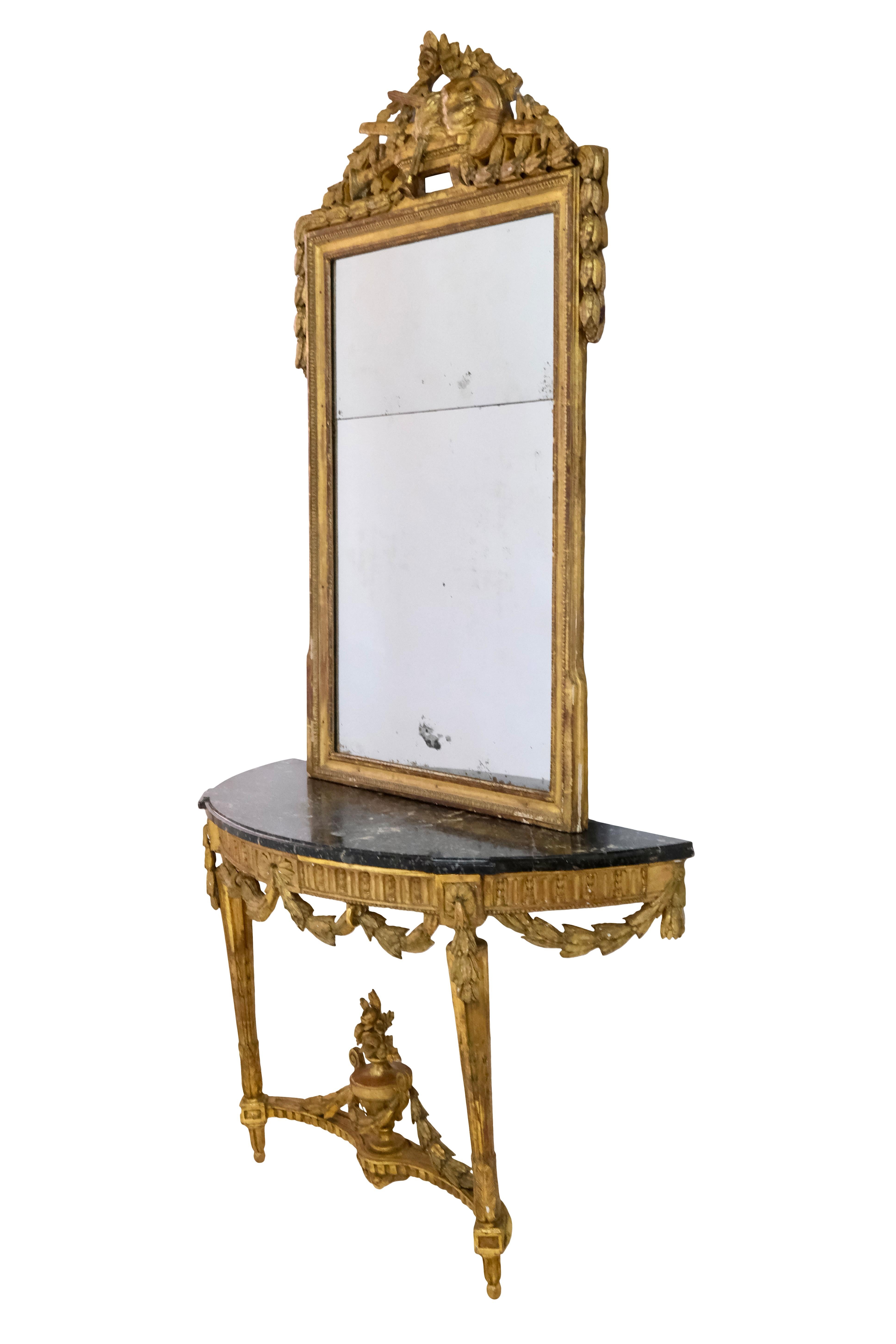 Console Table with Mirror

detailed ornaments 
wood, gold leaf 
marble 
original mirror with blind spots 

Louis XVI (also: Louis-seize), 
France, Mid 18th Century 

Mirror dimensions:
Width: 92 cm
Height: 156 cm

Console dimensions:
Width: 129