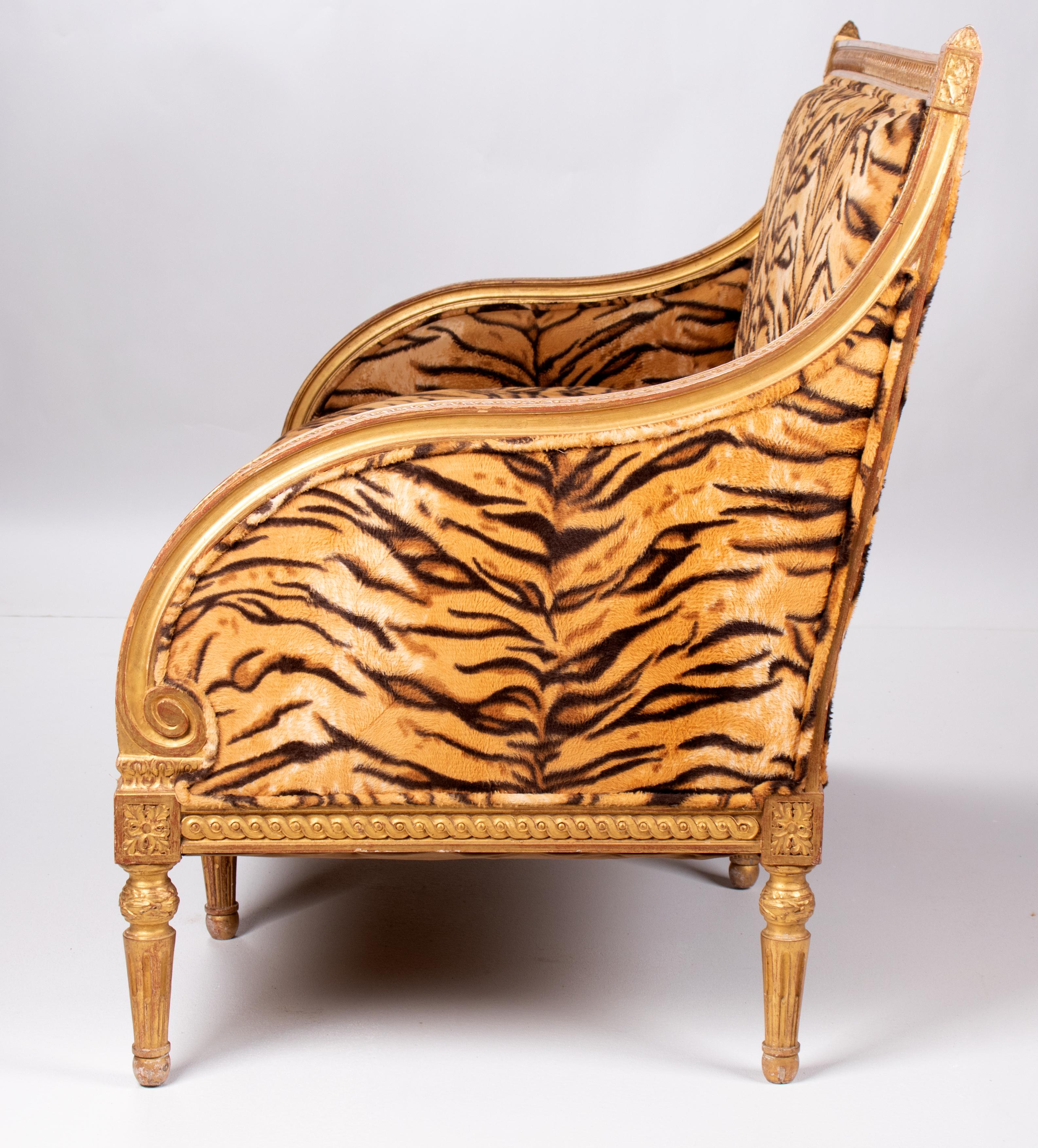 1750 pair of French Charles IV gold gilded upholstered sofas.