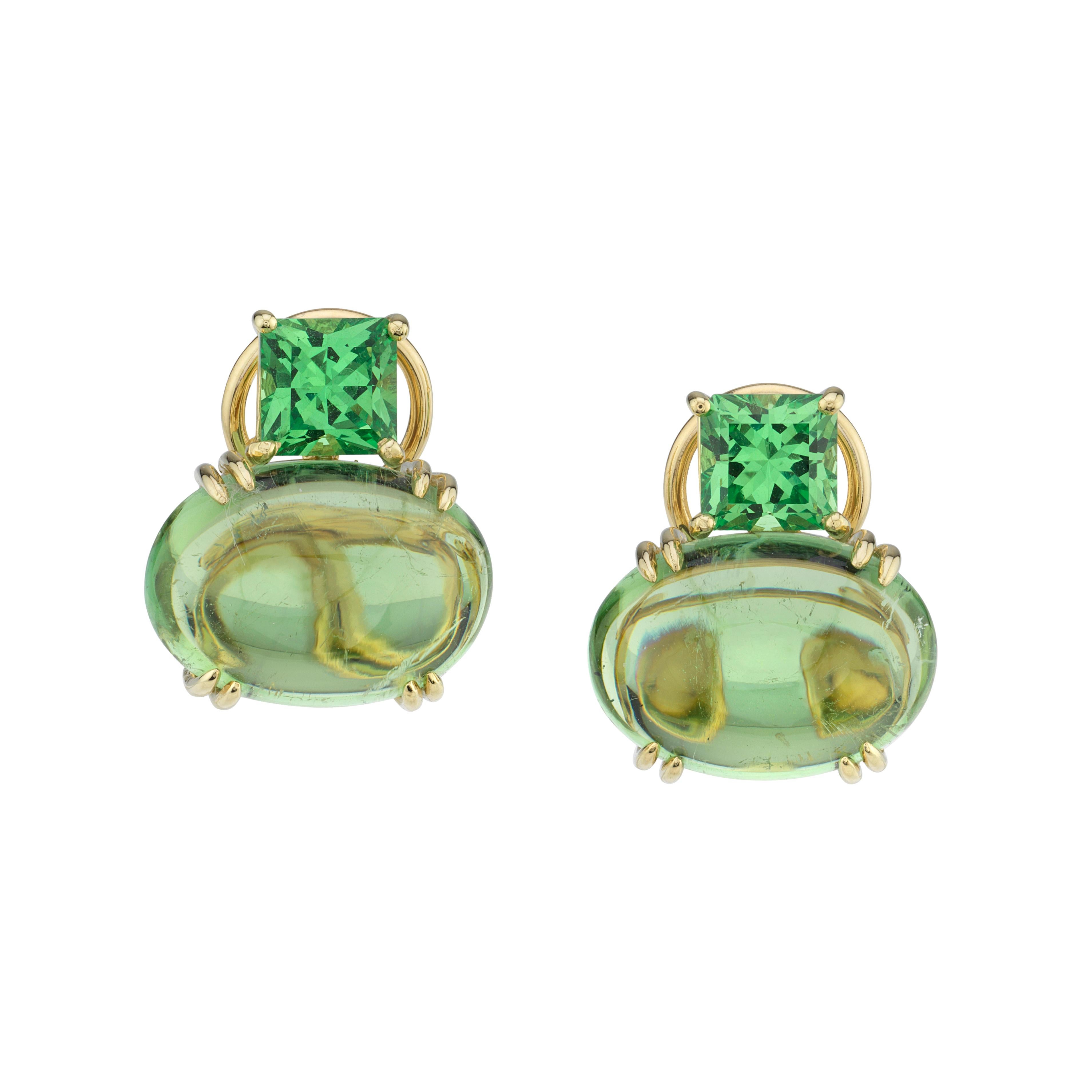 Two striking flavors of green gemstones are featured in these French clip earrings - spearmint-green, princess cut tsavorite garnets and peppermint-green tourmaline cabochons! The tourmaline cabochons are unusually large, clean and transparent.