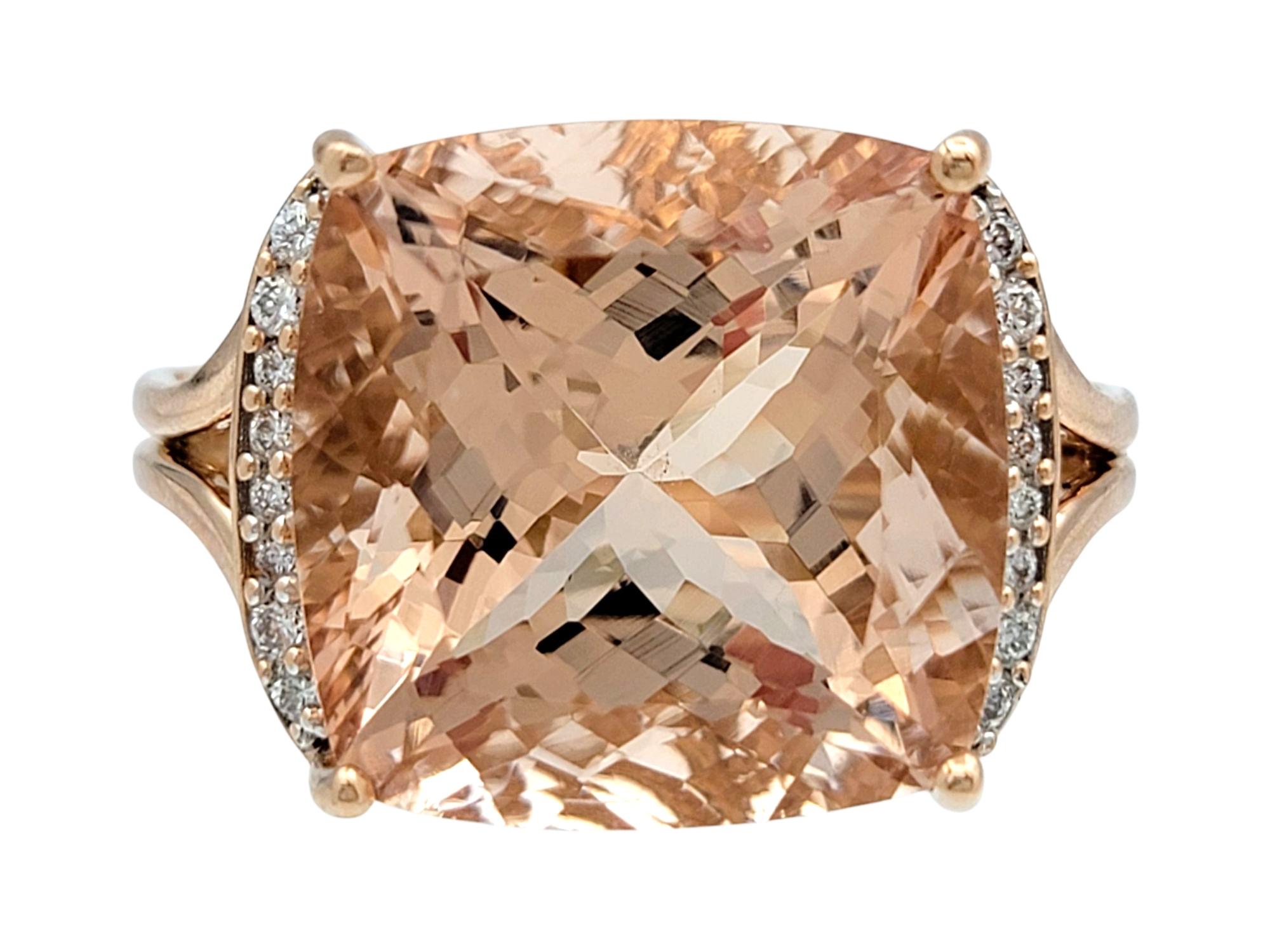 Ring Size: 7

This stunning ring showcases a breathtaking 17.57 carat morganite with a bold presence and soft elegance. The oversized cushion-cut center stone sits atop an intricately carved band, capturing light from every angle and creating a warm