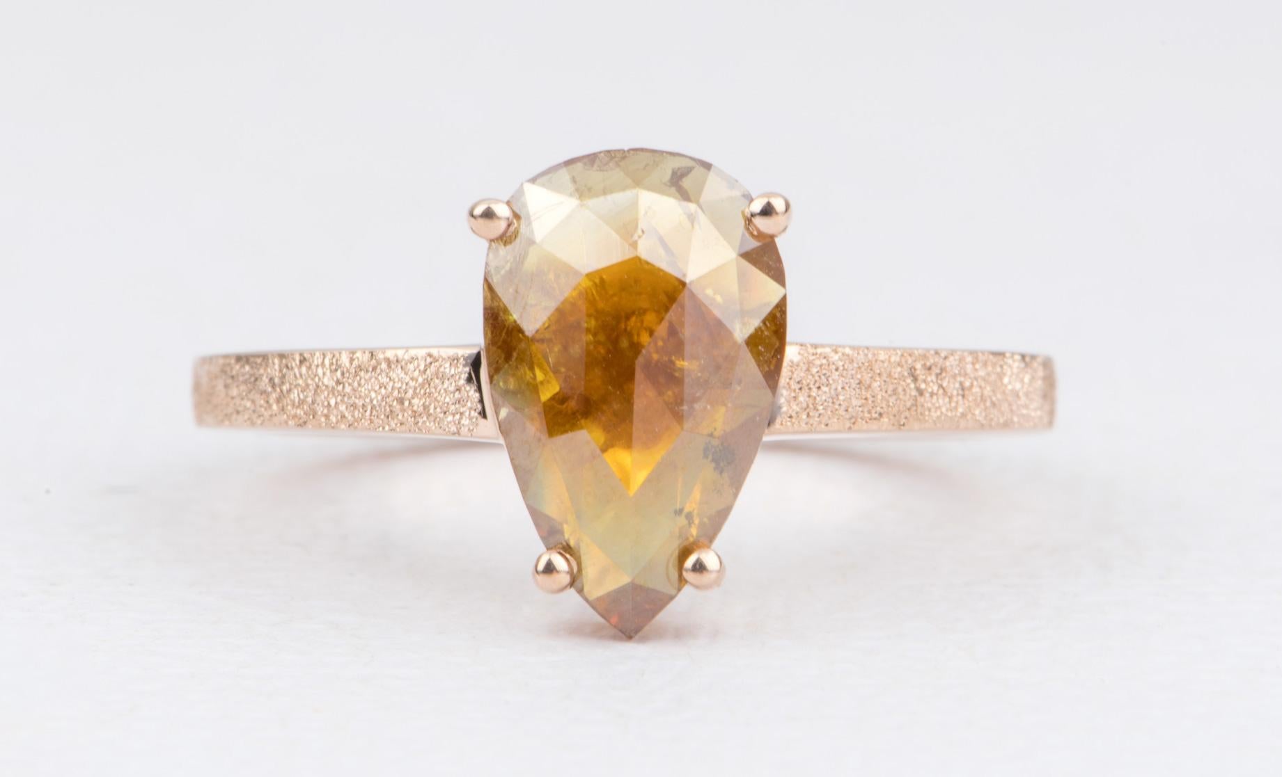 ♥  A stunning pear-shaped golden brown diamond is set on a solid14k rose gold setting
♥  The shank has an all-over heavy sandblast glitter texture, which makes the gold literally sparkle! It complements the rustic nature of the center stone
