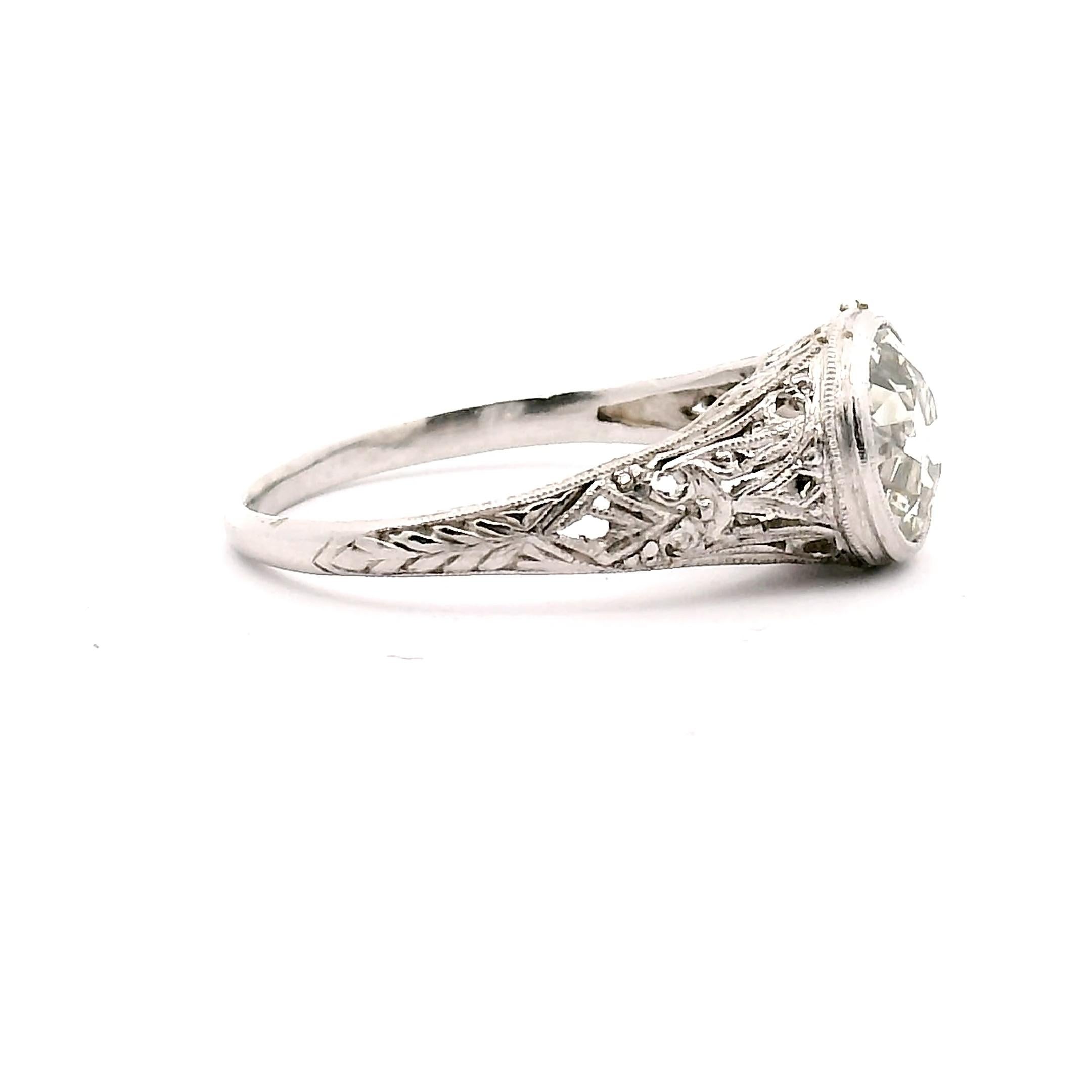 Antique lady's platinum filigree engagement ring with one bezal set, old european cut diamond. 

Center dia. approximately 1.75ct. 

Clarity grade is VS2

Color grade J-K

Platinum 3.5 grams 