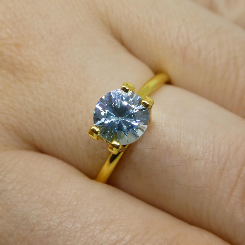 Description:

Gem Type: Zircon
Number of Stones: 1
Weight: 1.75 cts
Measurements: 6.68 x 6.72 x 4.52 mm
Shape: Round
Cutting Style:
Cutting Style Crown: Brilliant Cut
Cutting Style Pavilion: Modified Brilliant Cut
Transparency: Transparent
Clarity: