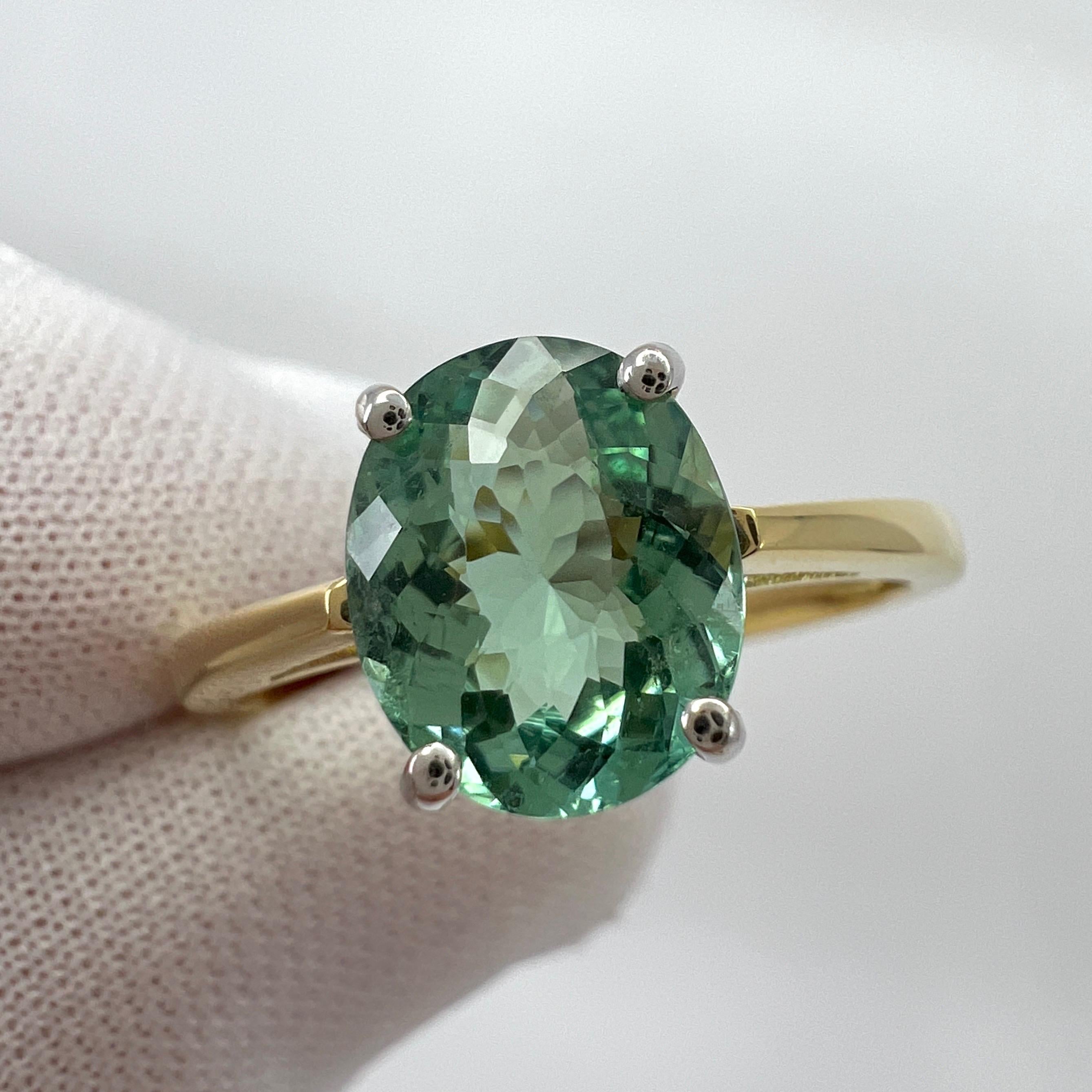 1.75ct Vivid Blue Green Tourmaline Oval Cut 18k Yellow White Gold Solitaire Ring In New Condition For Sale In Birmingham, GB