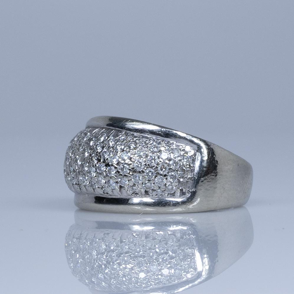 This elegant ring features a dazzling array of pave-set diamonds, meticulously arranged in 14k white gold. The sparkling diamonds create a seamless, shimmering effect that enhances the ring's timeless beauty. Perfect for any occasion, this ring