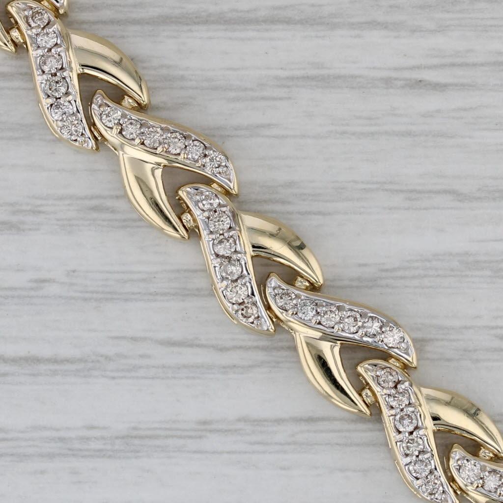 Informations sur les pierres précieuses :
- Diamants naturels -
Total des carats - 1.75ctw
Taille - Brilliante ronde
Couleur - H - J
Clarté - SI1 - I1

Métal : Or jaune 14k
Poids : 20,1 grammes 
Timbres : 14k
Style de chaîne : Maillons en X