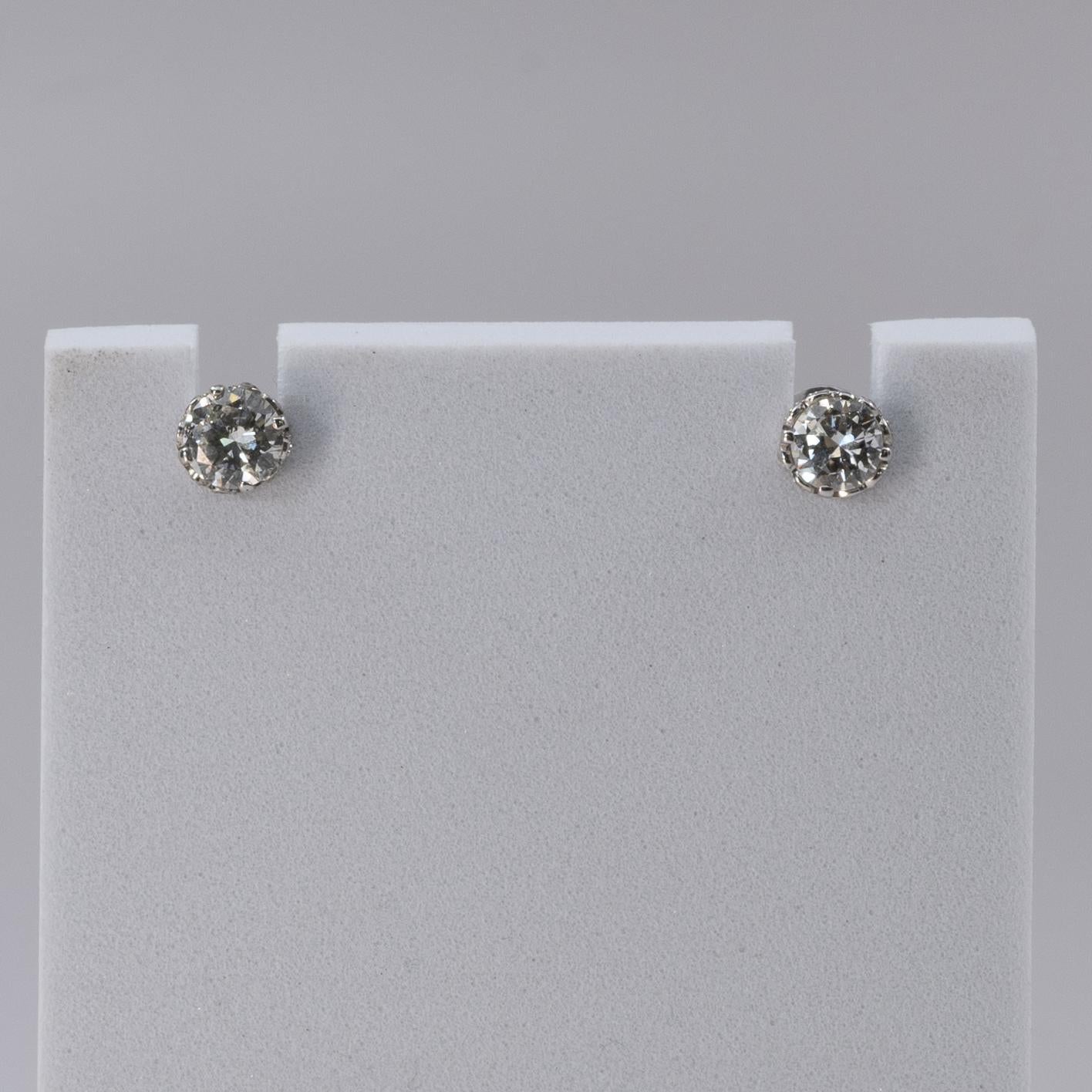 These classic stud earrings feature a pair of 1.75-carat total weight old European cut diamonds, renowned for their timeless brilliance and unique charm. Set in 18k white gold, the vintage diamonds are showcased with a sophisticated elegance that