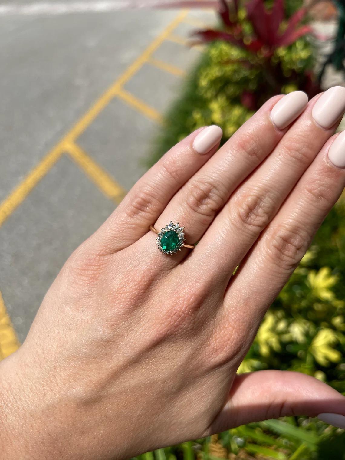 This is an exquisite, Colombian emerald and diamond tiara halo ring. The gorgeous setting lets sit a vivacious Colombian emerald with a rich dark green color and very good eye clarity. The emerald is not perfect and small imperfections do exist as