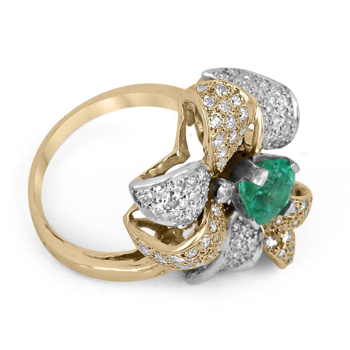 A stunning cocktail statement ring makes its grand appearance. A remarkable Colombian emerald weighing a little over a carat in size displays a ravishing, vivacious, medium emerald green color with very good clarity and luster. It is the center of