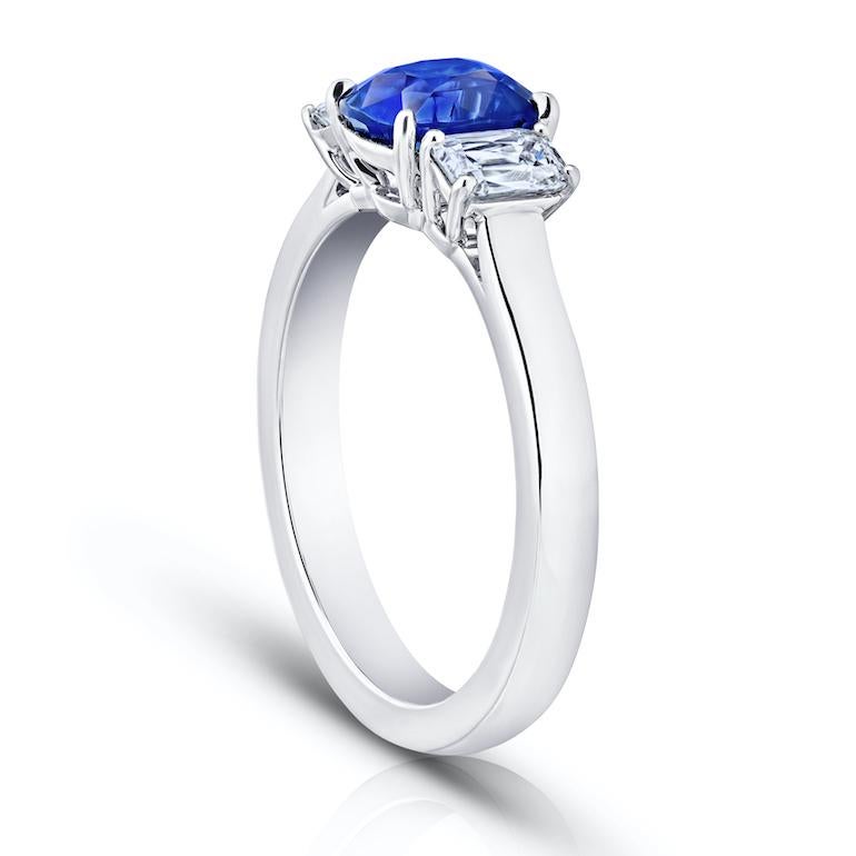 1.76 carat cushion (natural no heat) blue sapphire with antique cushion diamonds .60 carats set in a platinum ring.
