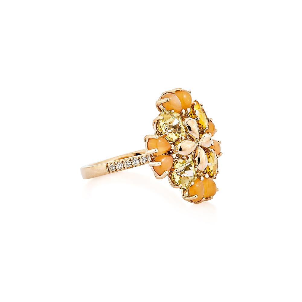 This fancy lemon quartz and citrine ring flower has a yellow hue. Accented with pear-cabochon cut orange moonstones and diamonds, this ring is made in rose gold and presents a beautiful yet elegant look.
  
Lemon Quartz Fancy Ring in 18Karat Rose