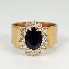 1.76 Carat Oval Blue Sapphire Diamond Halo 18 Karat Gold Cocktail Ring