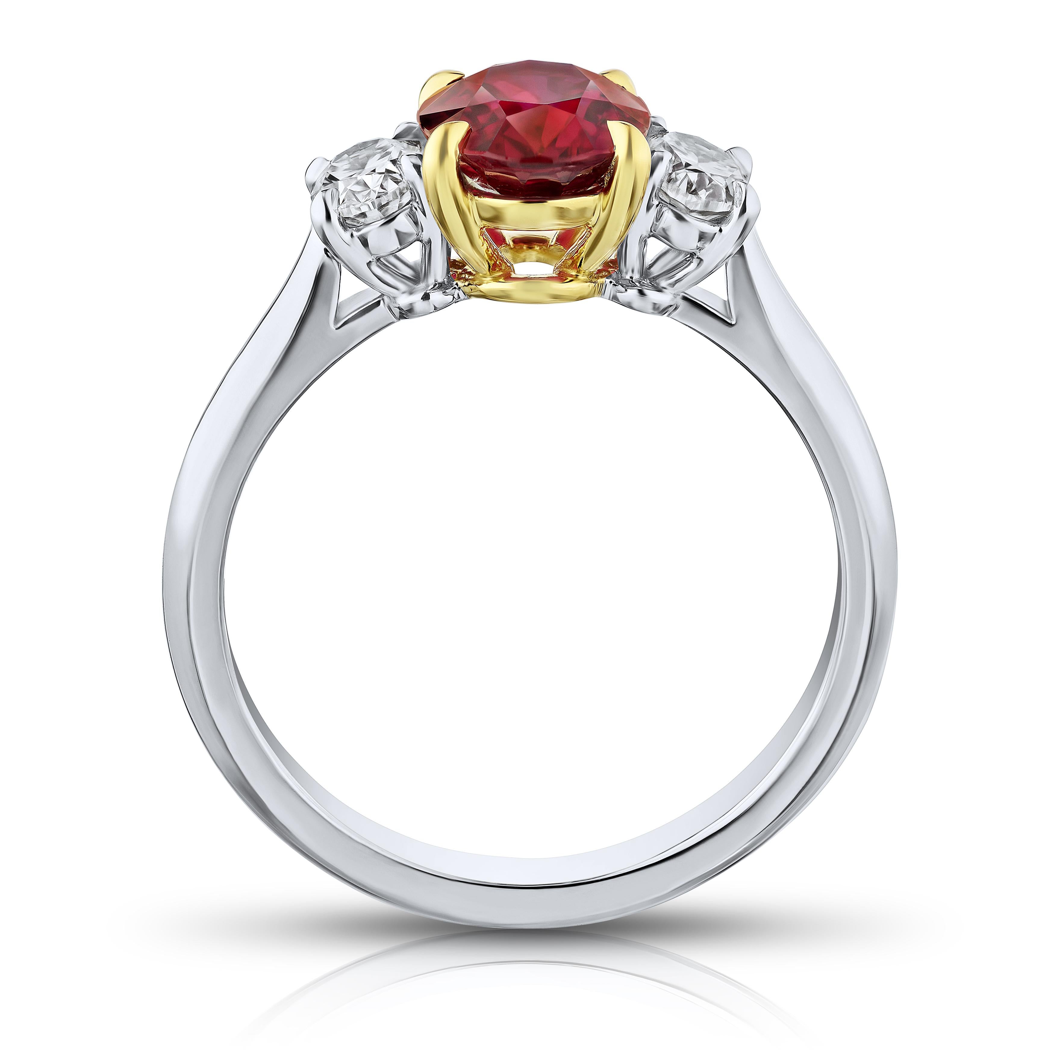 1.76 carat oval red ruby with oval diamonds .56 carats set in a platinum with 18k yellow gold ring. 
Ring is currently a size 7. Resizing to your finger size is included.