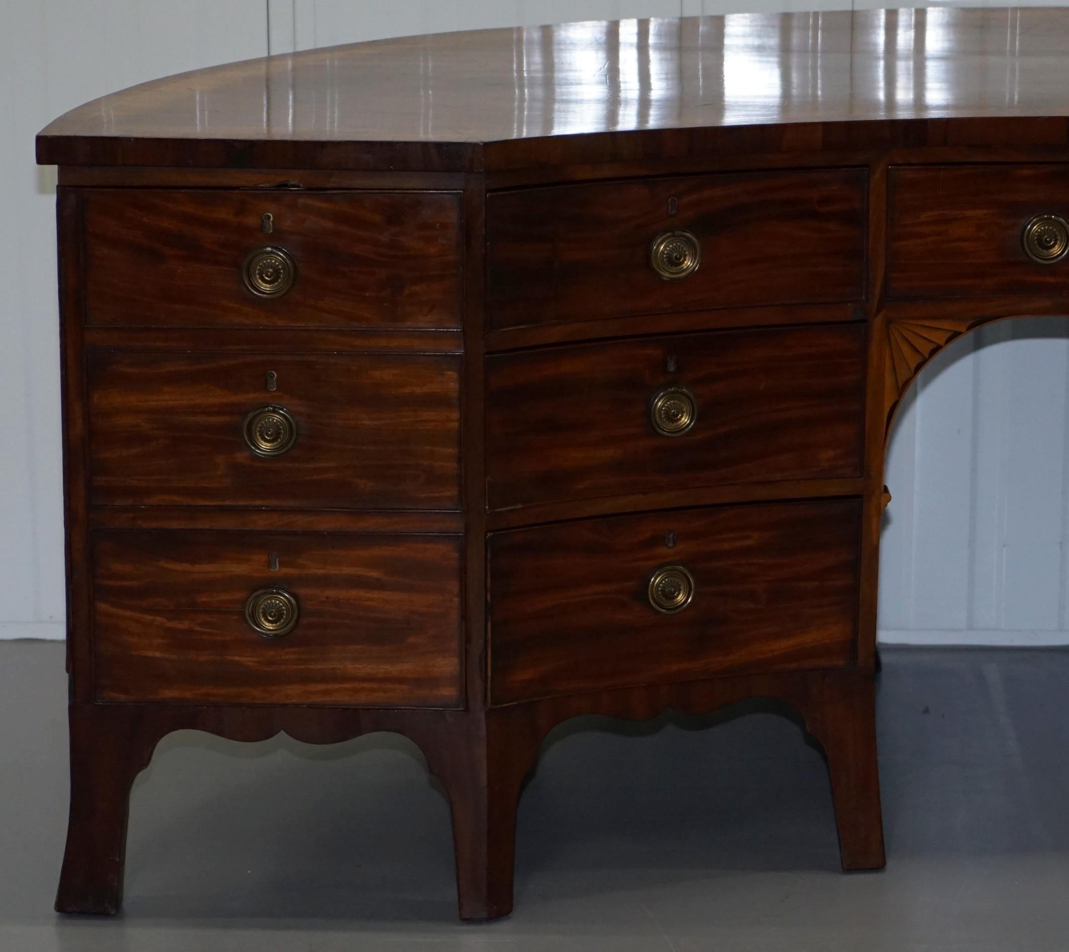 We are delighted to offer for auction this exceptionally rare and very fine circa 1760 Thomas Chippendale era George III mahogany crescent sideboard from The former Duke of Wellingtons home Athelhampton House in the Billiards room

This is a rare
