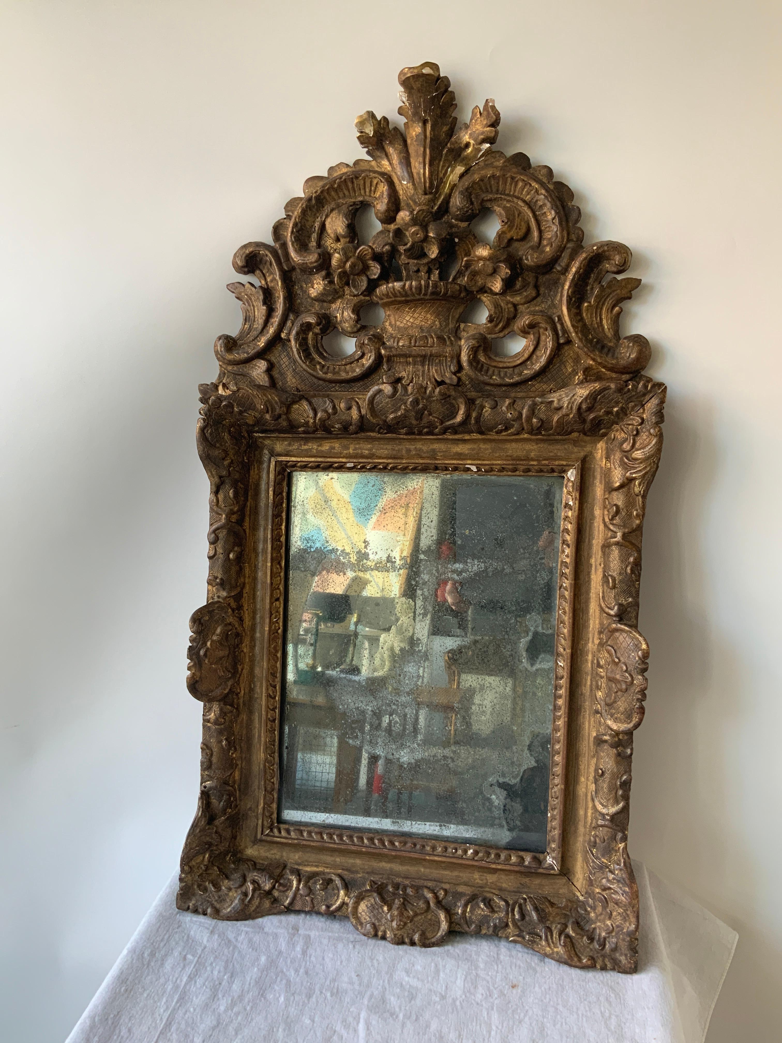 1760s French Provincial carved wood mirror. Mirror has age spots, it’s hard to see your reflection in it.
