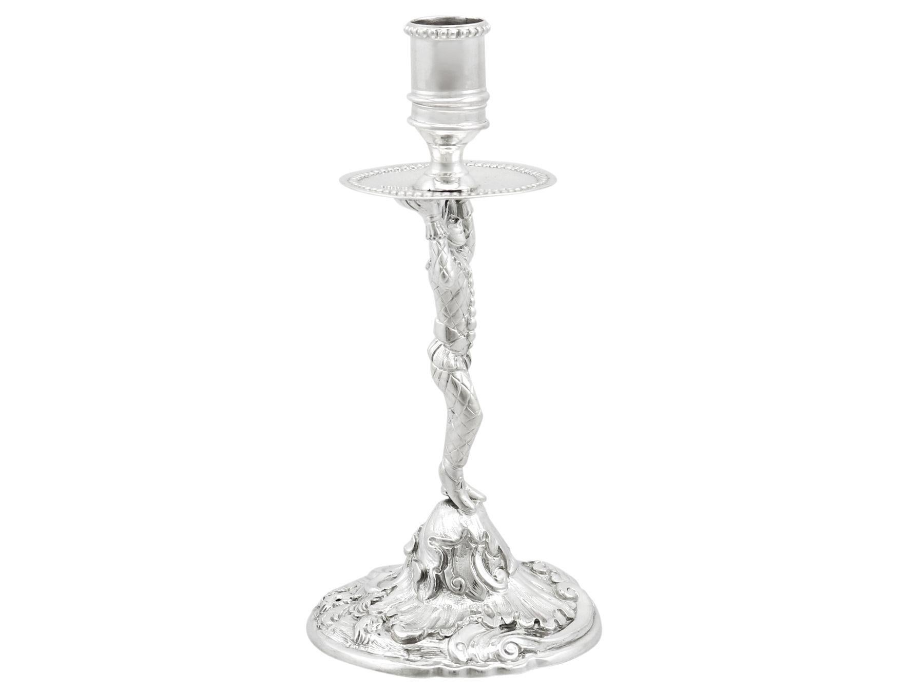 An exceptional, fine and impressive antique George III English cast sterling silver taperstick made by William Cafe; an addition of AC Silver's ornamental silverware collection.

This exceptional antique George III cast sterling silver taperstick