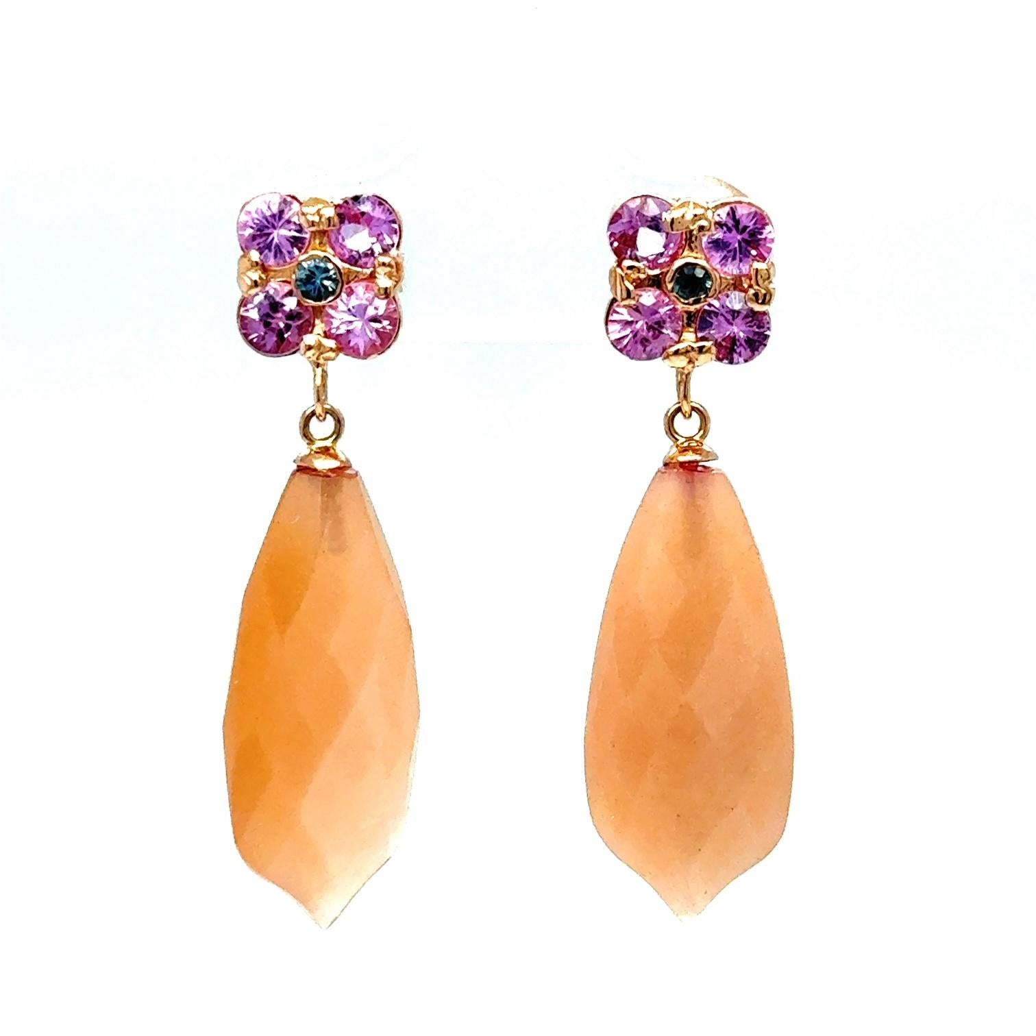 17.61 Carat Peach Moonstone Sapphire Rose Gold Drop Earrings

Item Specs:

2 Peach Moonstone stones weighing approximately 16.15 carats
(Measurements of Peach Moonstone is 22mm x 10mm)
10 Round Cut Pink and Blue Sapphires weighing approximately 1.46