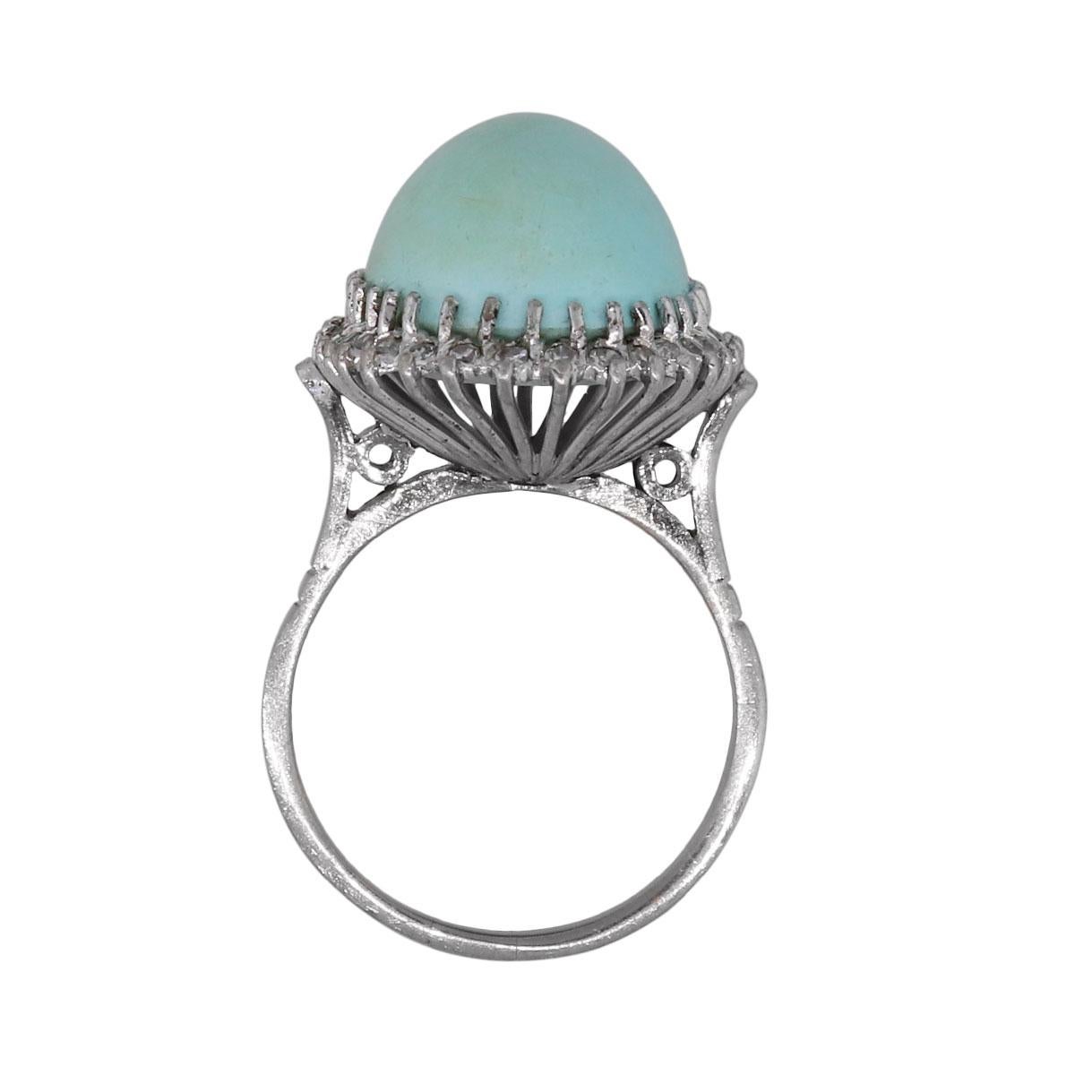 Material: 18k white gold
Diamond Details: Approximately 0.64ctw of round brilliant diamonds and baguette shape diamonds. Diamonds are G/H in color and SI in clarity
Gemstone Details: Oval cabochon shape turquoise is approximately 17.63ct.
Ring Size: