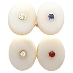 17,64 ct Achat, 0,11 ct Saphir, 0,11 ct Rubin, 0,19 ct Diamant – Manschettenknöpfe aus Gelbgold
