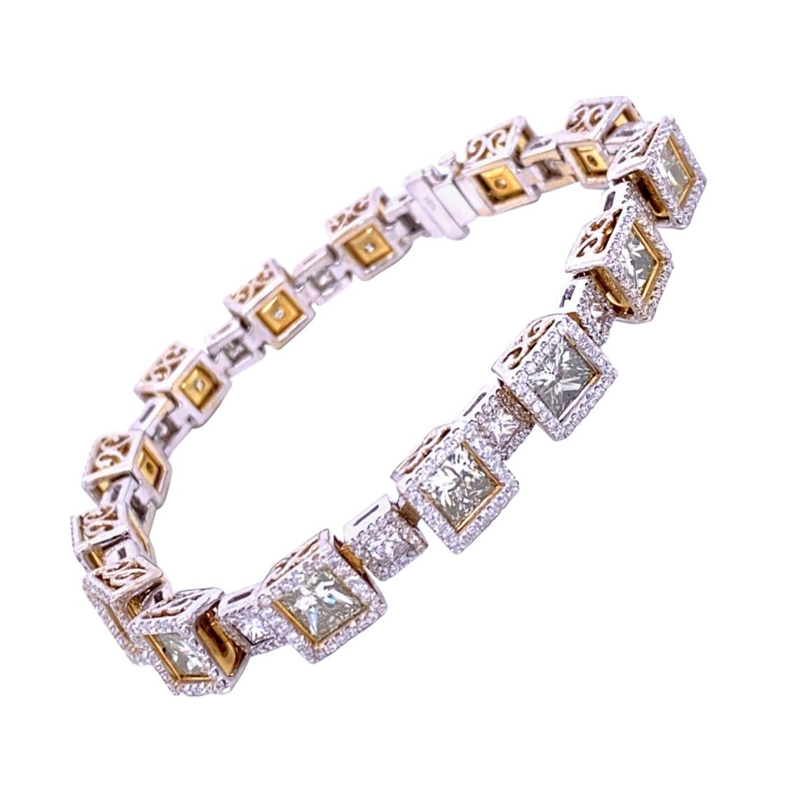 This beautiful 18K Gold Diamond Tennis Bracelet  consists of 14 Large and 15 Small links set with Princess Cut centers surrounded by pave set Halo. 
Total Weight of Large diamonds: 13.81 Ct
Total Weight of small diamonds (Pave Rounds): 3.85 Ct
Total
