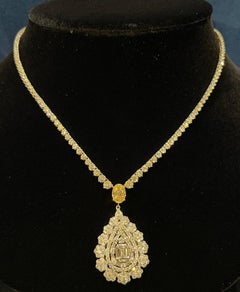  17.69 Carat Diamond Necklace with Fancy Yellow Oval Diamond and Pear Cluster