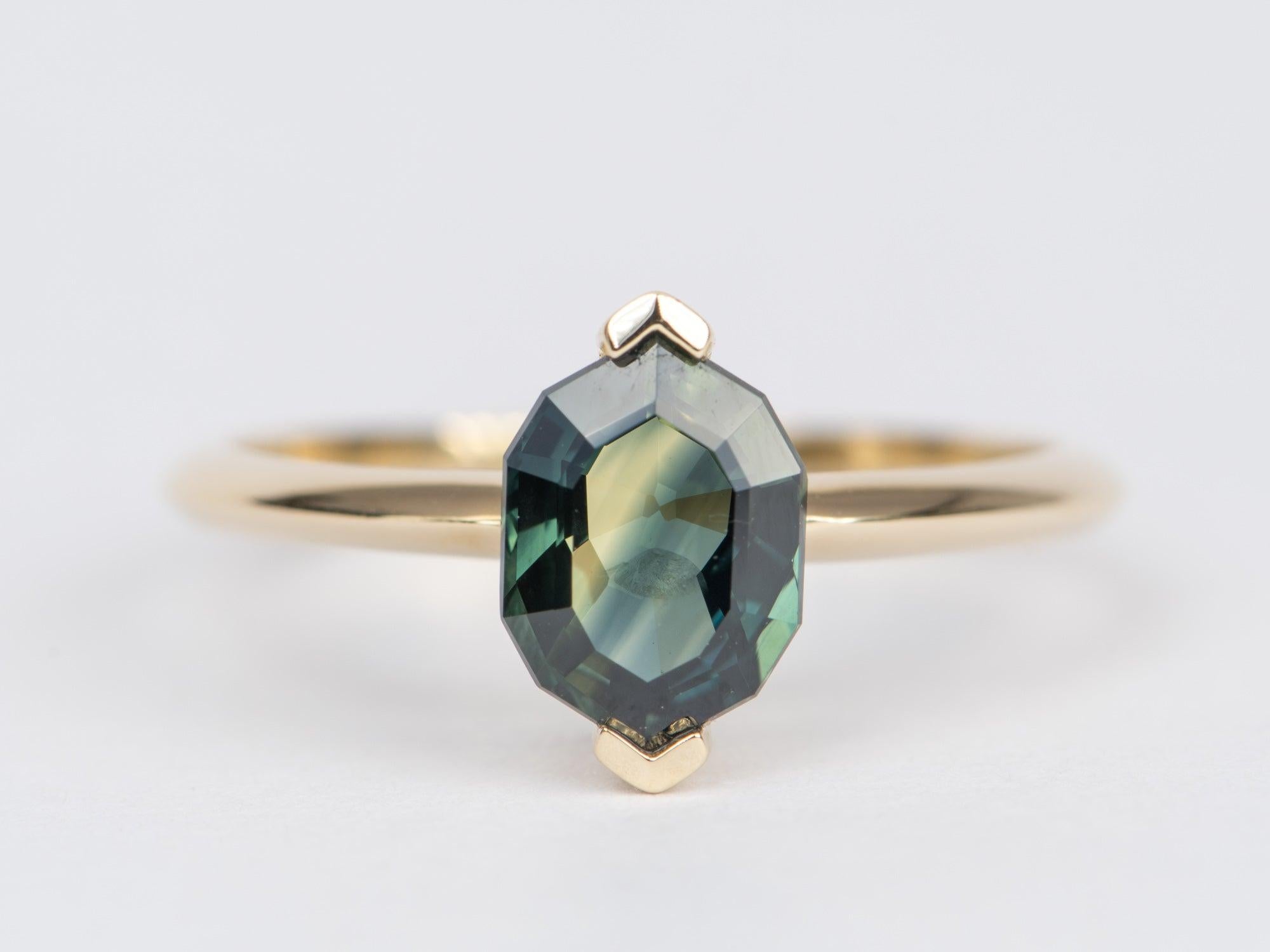 ♥ Solid 14k yellow gold ring set with a beautiful solitaire Parti Sapphire
♥ Gorgeous blue green color!
♥ The item measures 10mm in length, 6mm in width, and stands 4.9mm from the finger

♥ US Size 7 (Free resizing up or down 1 size)
♥ Band width: