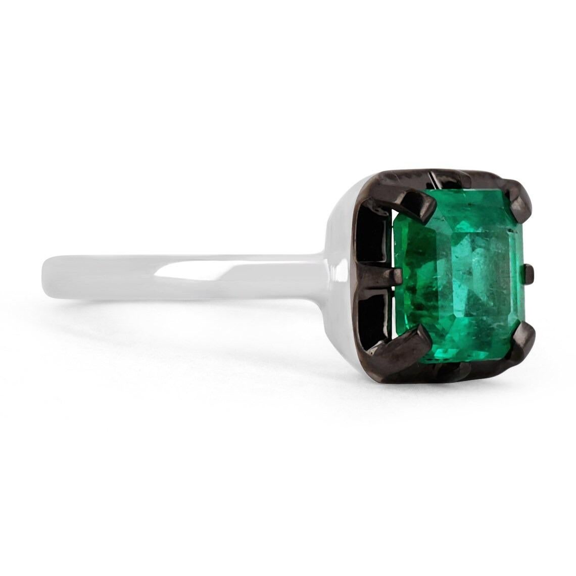 Displayed is a one-of-a-kind, natural emerald solitaire Asscher-cut engagement ring/right-hand ring in 18K white gold, with black rhodium over the face. This gorgeous solitaire ring carries a full 1.76-carat Colombian emerald in a eight-prong