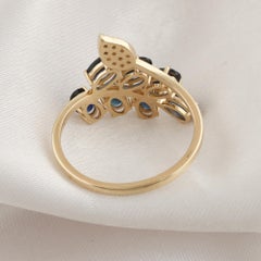1.77 Carat Blue Sapphire 0.08 Carat SI/H Diamond Leaf Ring 14 Karat Yellow Gold