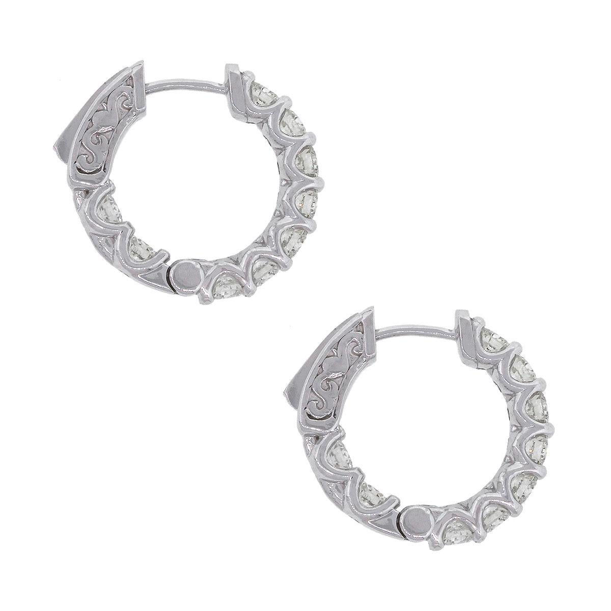 Material: 14k White Gold
Style: Diamond Inside Out Hoops
Diamond Details: 18 stones, Approximately 0.74ctw of round brilliant diamonds. Diamonds are G/H in color and SI in clarity.
Earring Measurements: 0.75″ x 0.11″ x 0.70″
Total Weight: 6g
