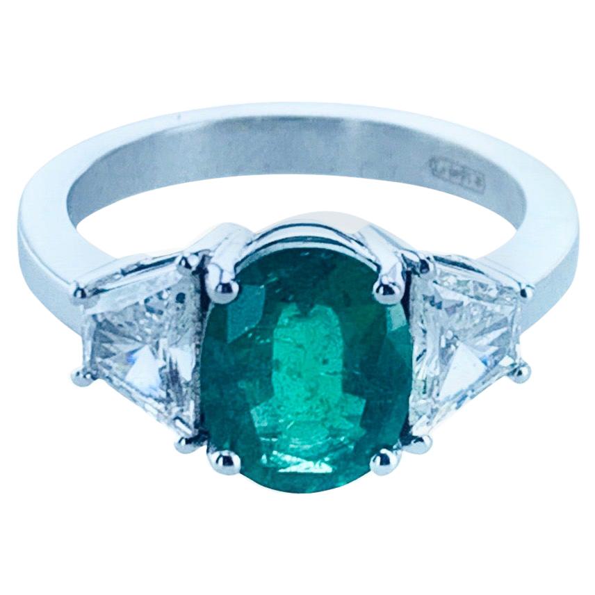 1.77 Carat Oval Emerald and Baguette Diamond Cocktail Ring