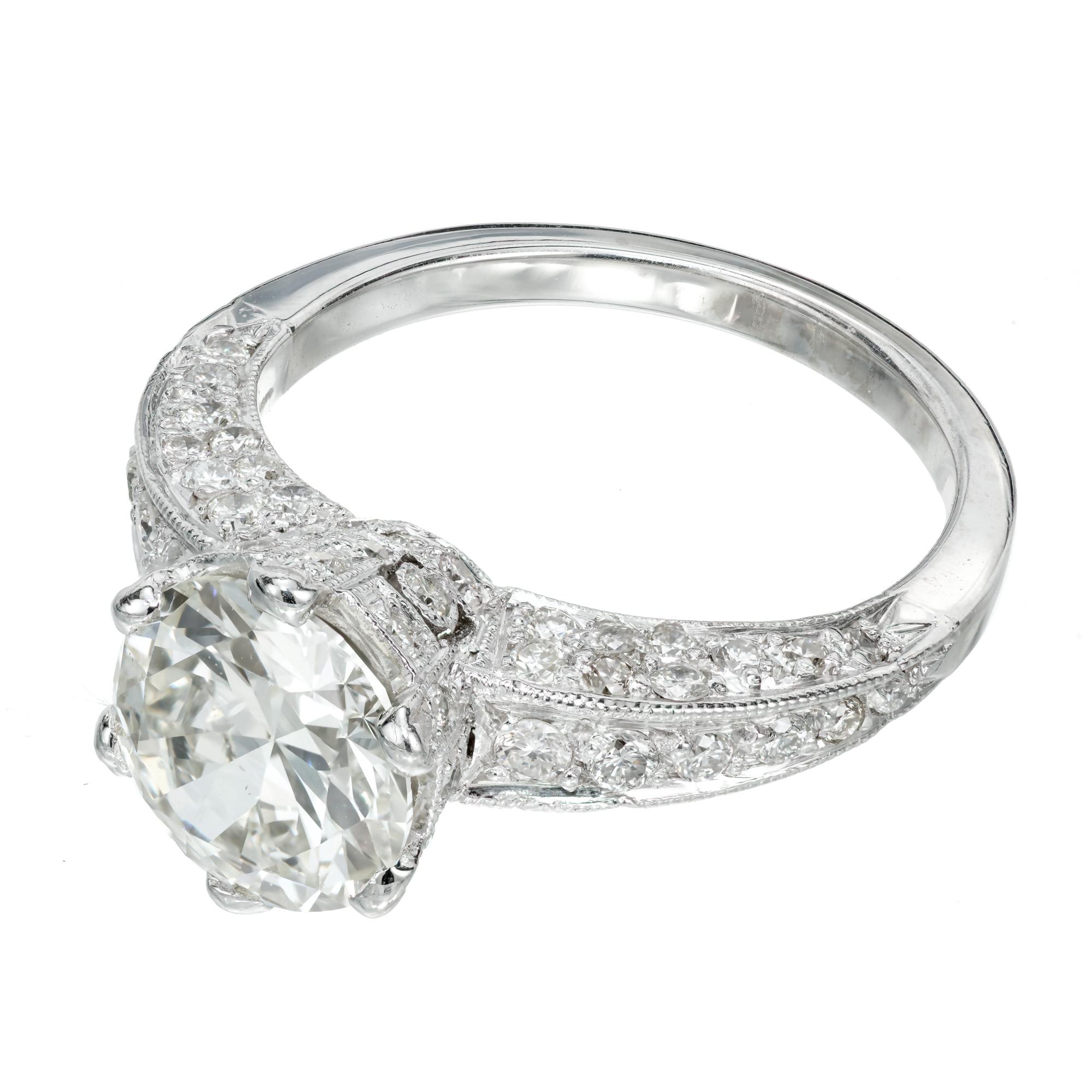 1940's transitional cut round diamond engagement ring. EGL certified round transitional cut diamond in a platinum six prong setting with 58 round accent diamonds. 

1 round transitional diamond total weight 1.77ct, J-K, SI1, 8.12mm across. 54.3%