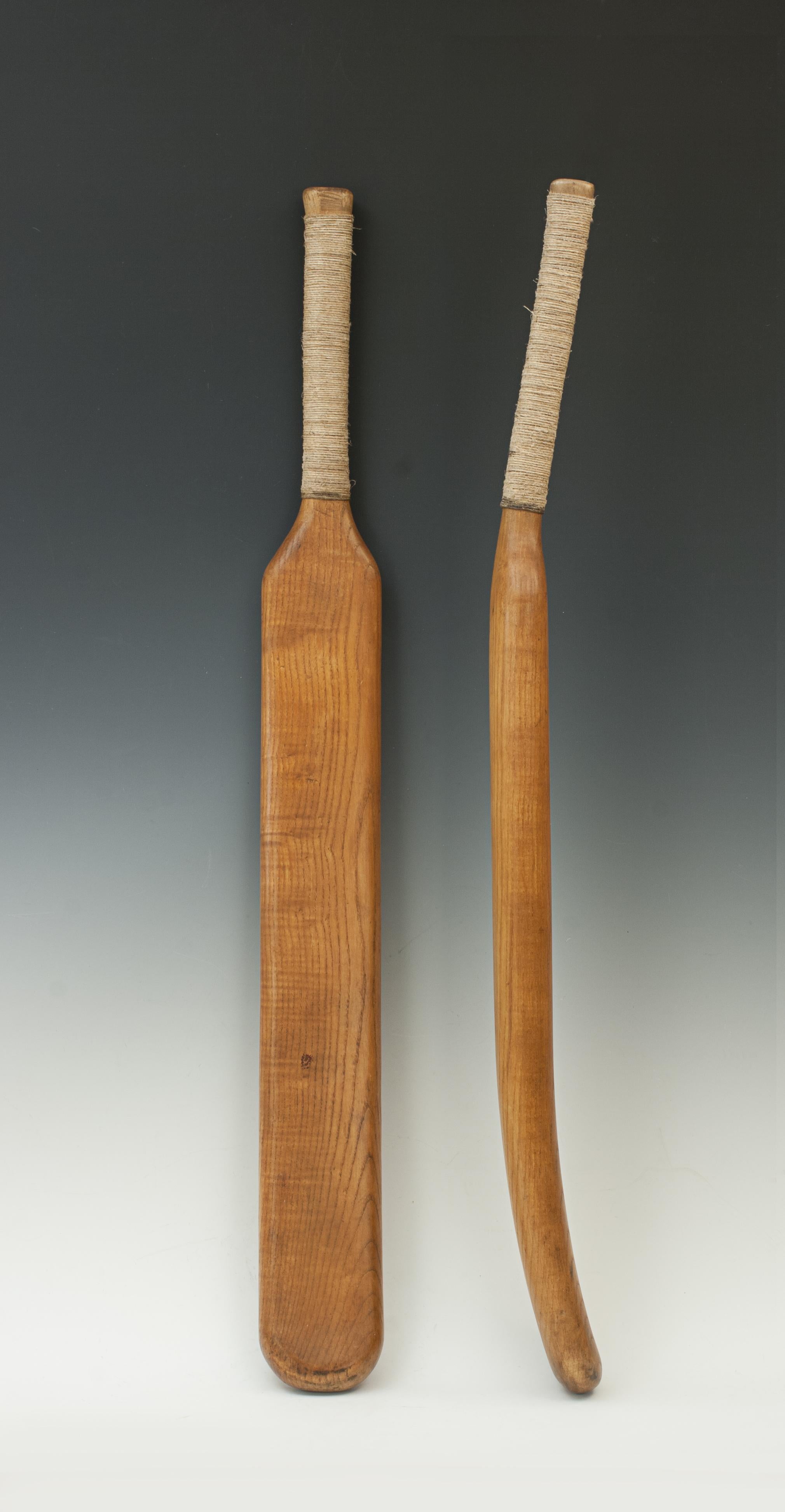 Curved early oak cricket bat.
An unusual shaped, heavy weight, one piece cricket bat of the style used in the 1770s. The blade has an inward bow, convex surface, instead of being flat like the more traditional bats we think of today. The handle has