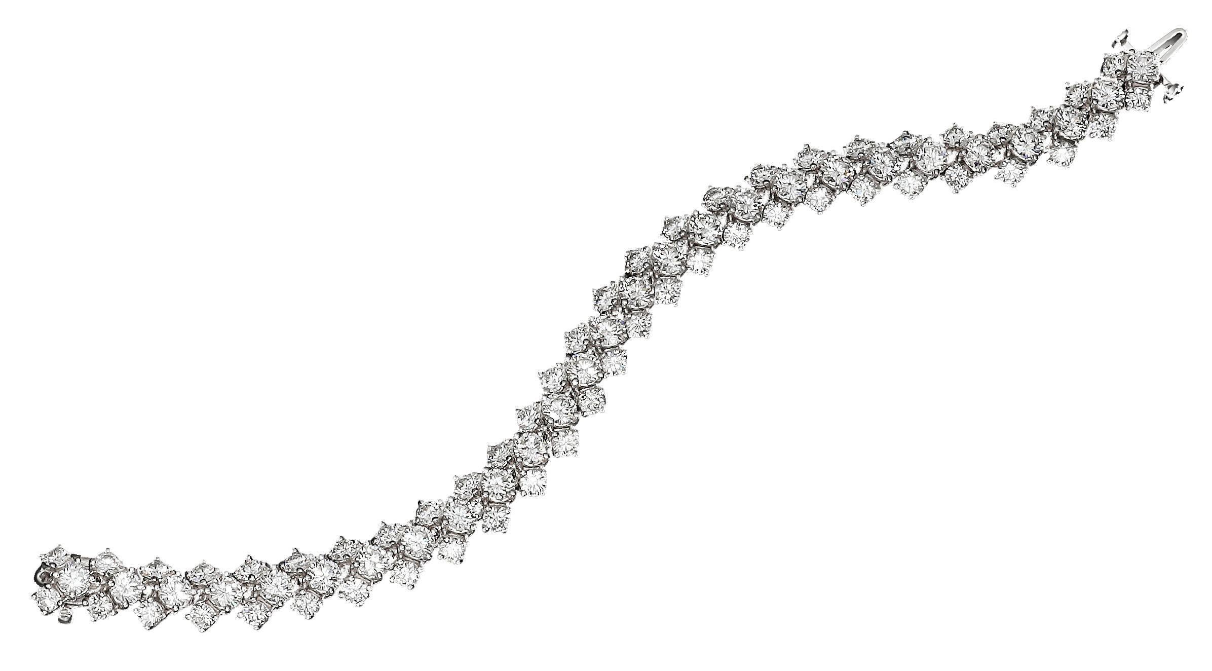 A unique and beautiful style tennis bracelet that packs a lot of elegance and sparkle  showcasing an amazing 17.71 carats total of brilliant round diamonds intricately designed in a unique three row style. Mounted in 18K white gold and 7 inches in