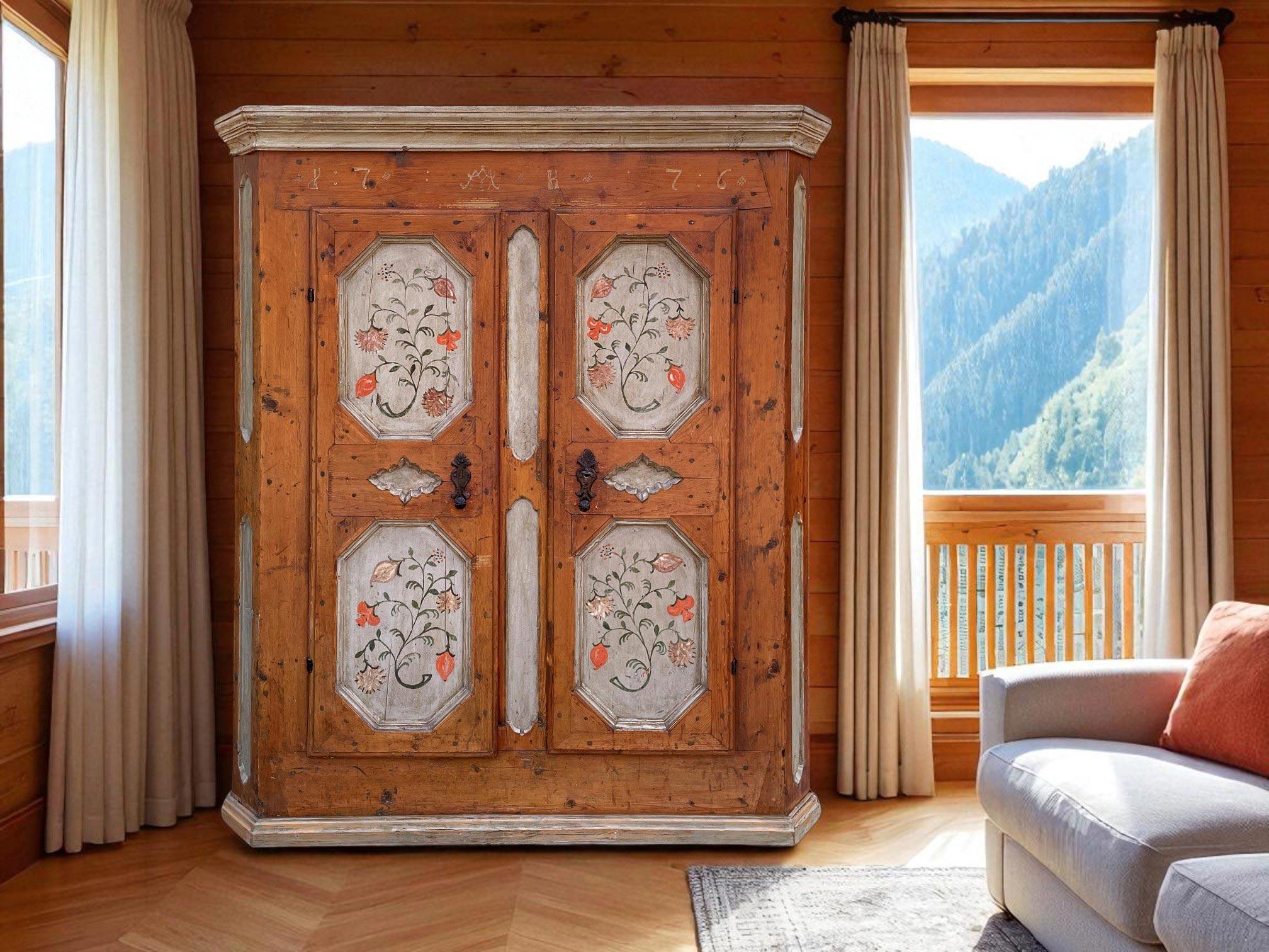 Antique Painted Cupboard Dated 1776 

Technical information:
Period: dated 1776
Origin: Italian Alps (Tyrol)
Wood type: Fir

Height: 170 cm  66.93 in
Width: 138 cm (146 cm with frame)  54.33 in (57.48 in with frame)
Depth: 45 cm (50 cm with frame) 