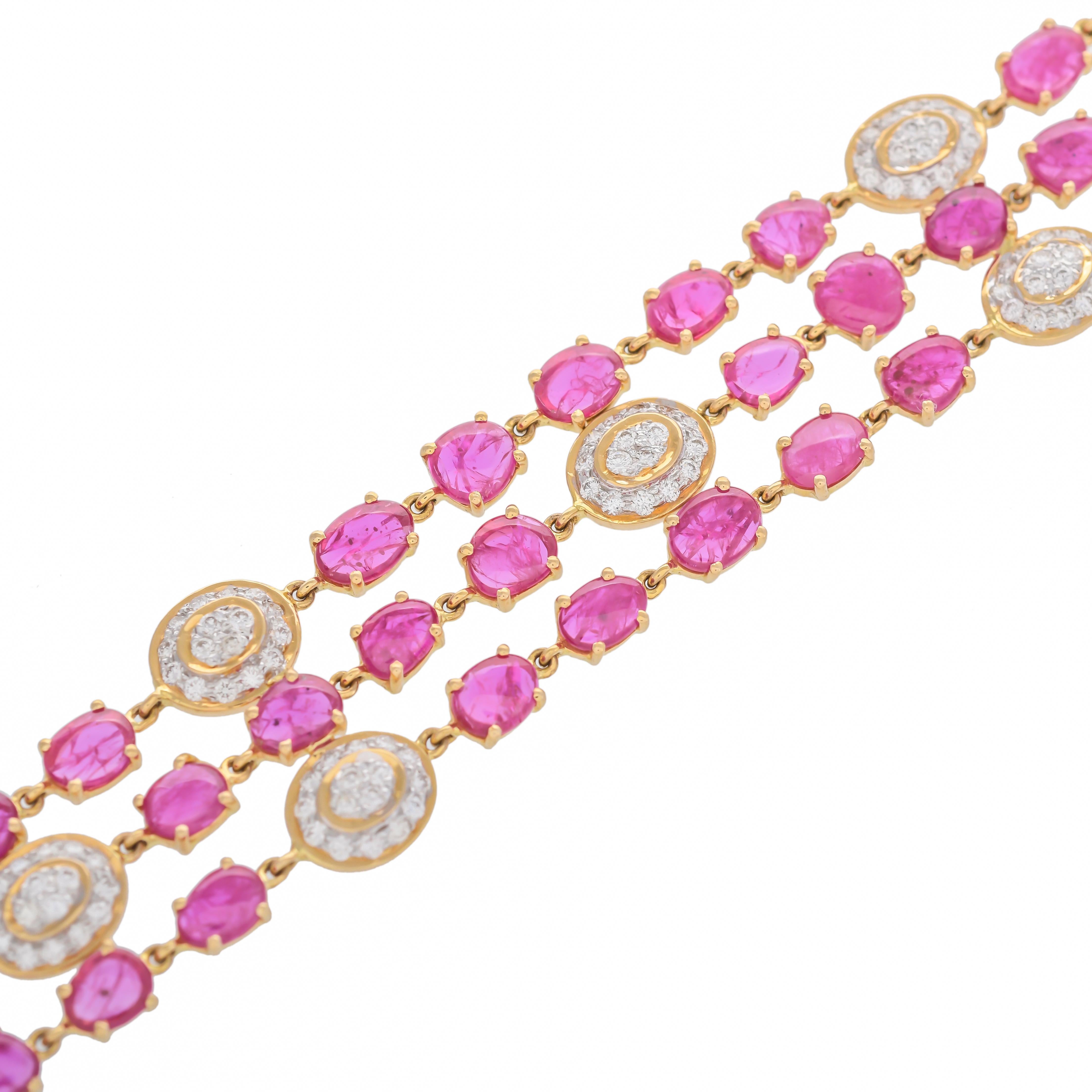 This elegant bracelet comprises of three rows of oval-shaped ruby flats well-matched in lustre, tone and saturation with a total ruby weight of approximately 17.77 carats, connected to a diamond set oval framed in a flexible mesh setting to a