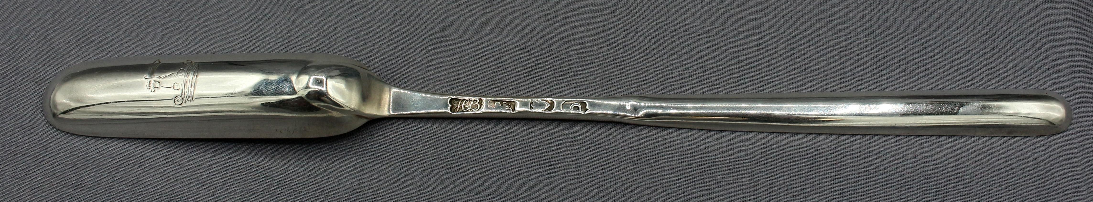 Sterling silver marrow scoop by Hester Bateman, London, 1777. Rolls Family Crest: out of a ducal coronet an arm from elbow, in armor, brandishing a saber (Fairbairn, p115 #5). Old English pattern. Fine condition. 1.40 troy oz.
9.5