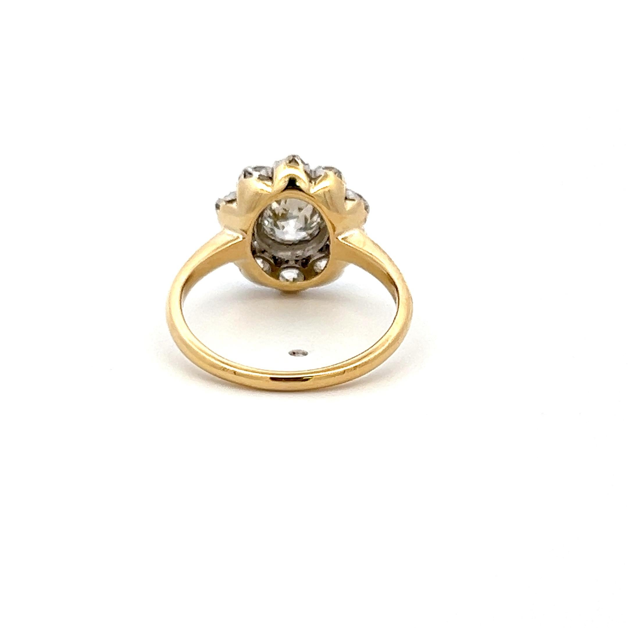 Title:
This exquisite Edwardian-style ring showcases 1.77 carats of antique-cut diamonds in a refined two-tone 18K yellow gold and platinum setting. At the center sits a 0.77-carat Old European cut diamond, admired for its romantic, hand-cut facets