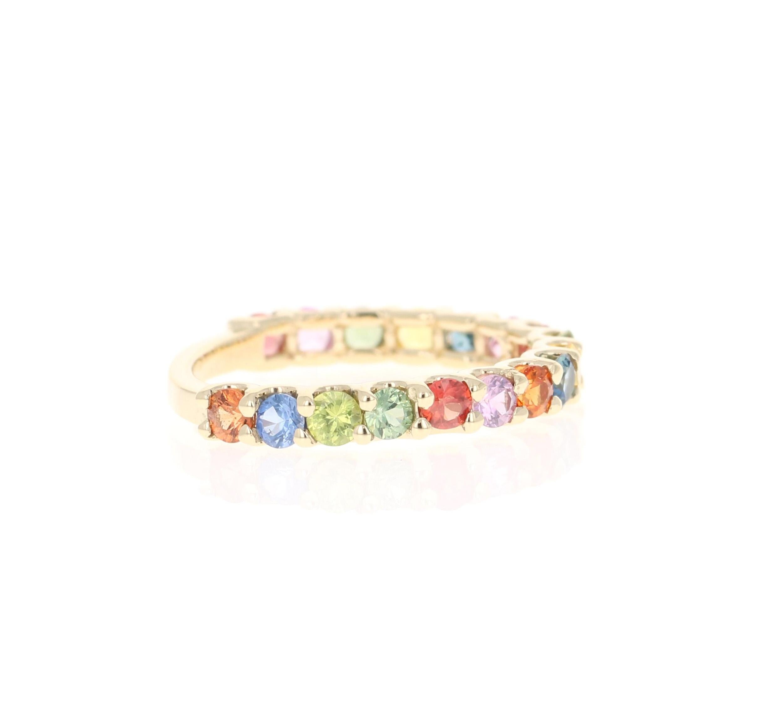 This beautiful band has 17 Multi Colored Sapphires that weigh 1.78 carats. 
The ring is curated in 14 Karat Yellow Gold and weighs approximately 2.1 grams 

It is a ring size 7 and can be re-sized at no additional charge. 

