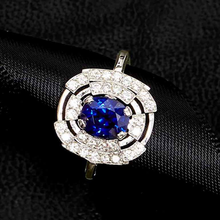 This modern British-London Hallmarked 18 karat white gold ring, set with highest quality of diamonds and 1.78 carat of rare royal blue color (untreated) natural sapphire from Burma is from MAIKO NAGAYAMA's Haute Couture Collection called