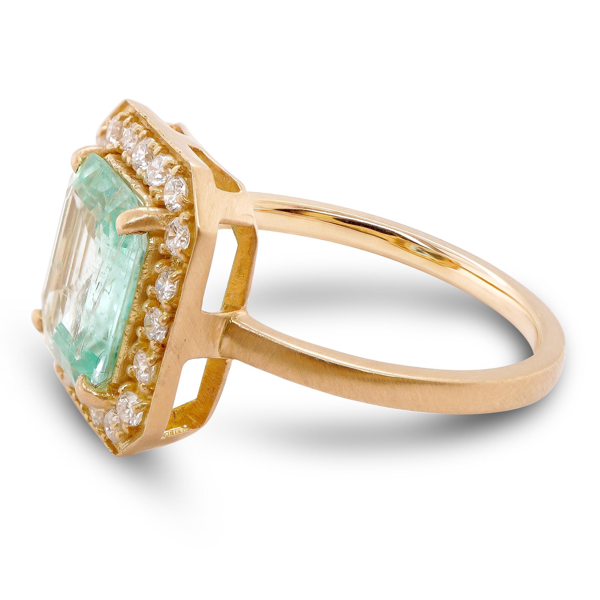 A smooth shade of pastel colored emerald weighing 1.78 carat is set along with 0.28 carats of white round brilliant diamond in this beautiful solitaire 18K Gold ring.

The details of the diamond are mentioned below:
Color: F
Clarity: VS
