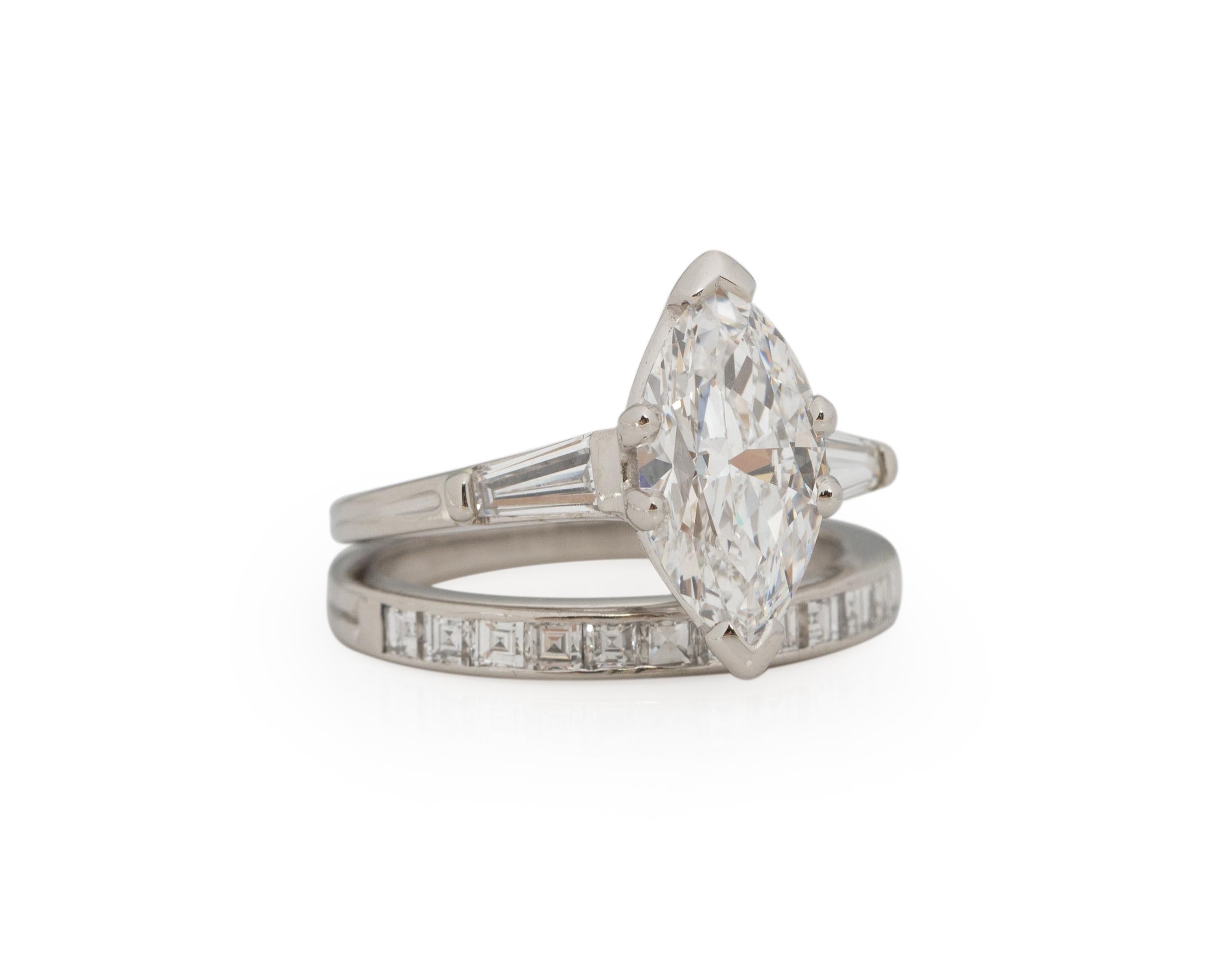 Ring Size: 6.5
Metal Type: Platinum [Hallmarked, and Tested]
Weight: 7 grams

Center Diamond Details:
TIFFANY REPORT# 565536
Weight: 1.78ct
Cut: Vintage Marquise
Color: D
Clarity: VVS1
Measurements: mm

Side Stone Details:
Weight: .33ct
Cut: Tapered