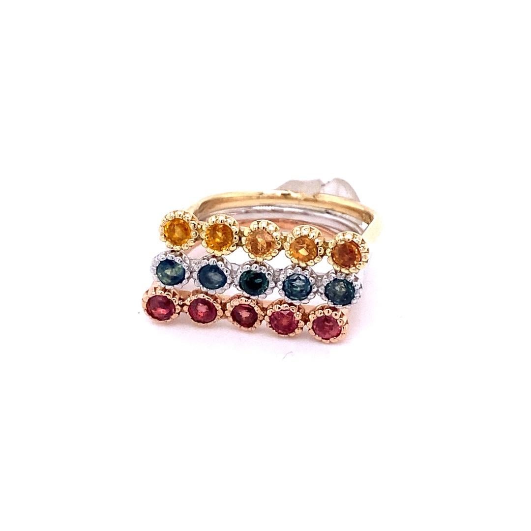1.78 Carat Multi Color Sapphire Gold Stackable Bands

Set of 3 cute and unique 1.78 Carat Sapphire bands that are sure to be a great addition to your accessory collection!   
There are 5 Round Cut Sapphires in each band and the Sapphire color is