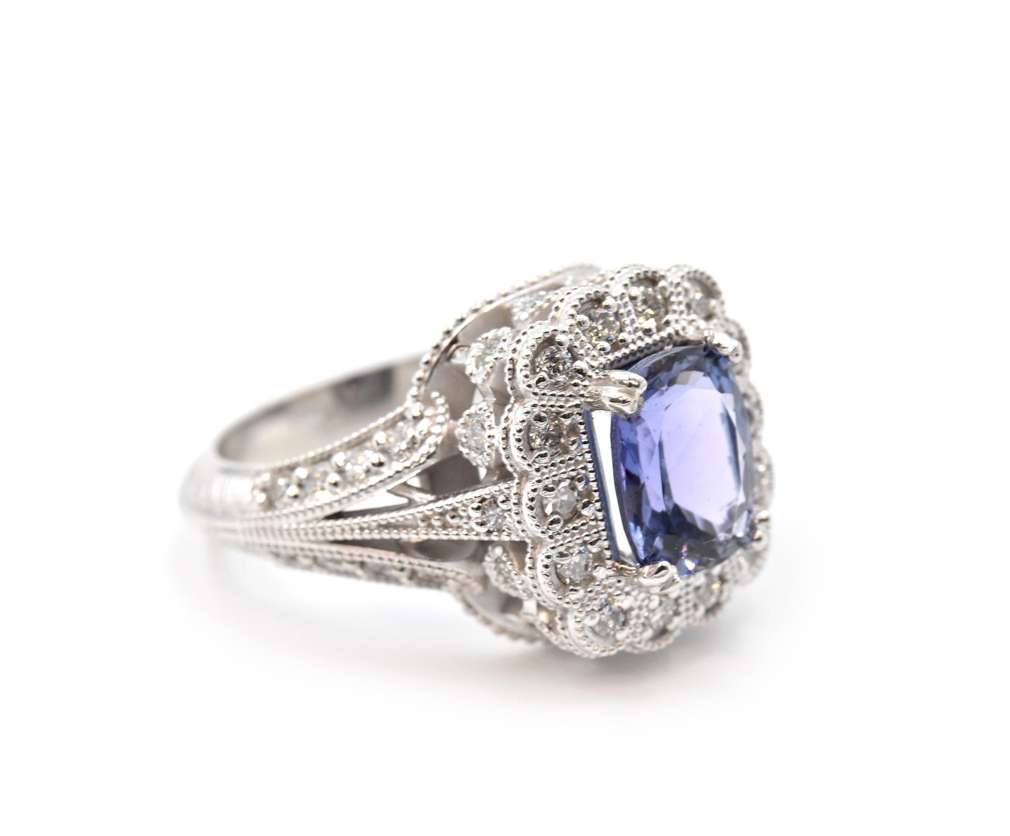 Designer: custom design
Material: 14k white gold
Tanzanite: 1.78 carat oval cut
Diamonds: 41 round brilliant cut = 1.00 carat weight
Color: G
Clarity: VS
Ring Size: 8 (please allow two additional shipping days for sizing requests)
Weight: 8.2 grams 
