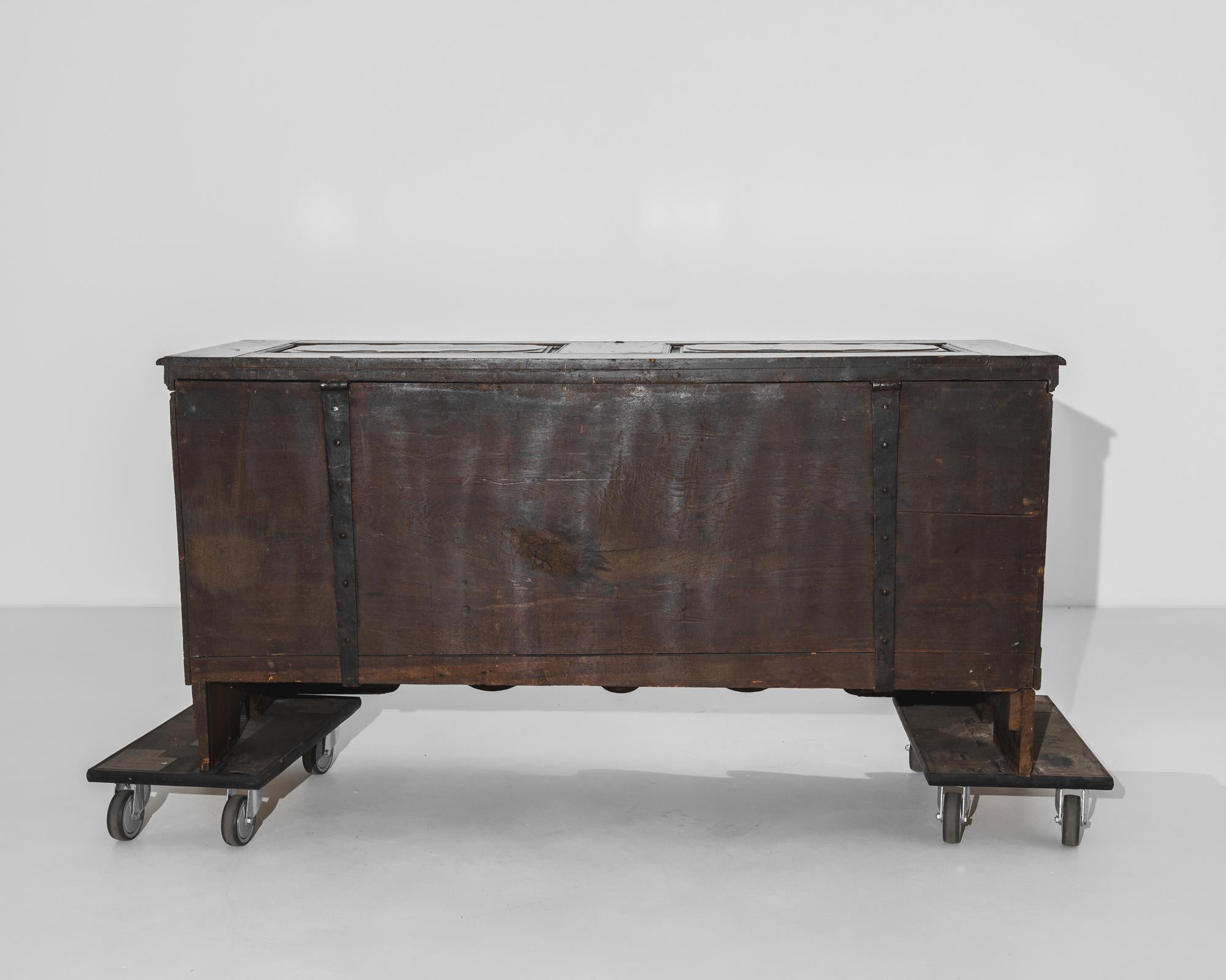 Stepping into the elegant interiors of late 18th-century Germany, this wooden trunk from the 1780s stands as a testament to the enduring craftsmanship and historical significance of the era. Crafted with meticulous attention to detail, this piece