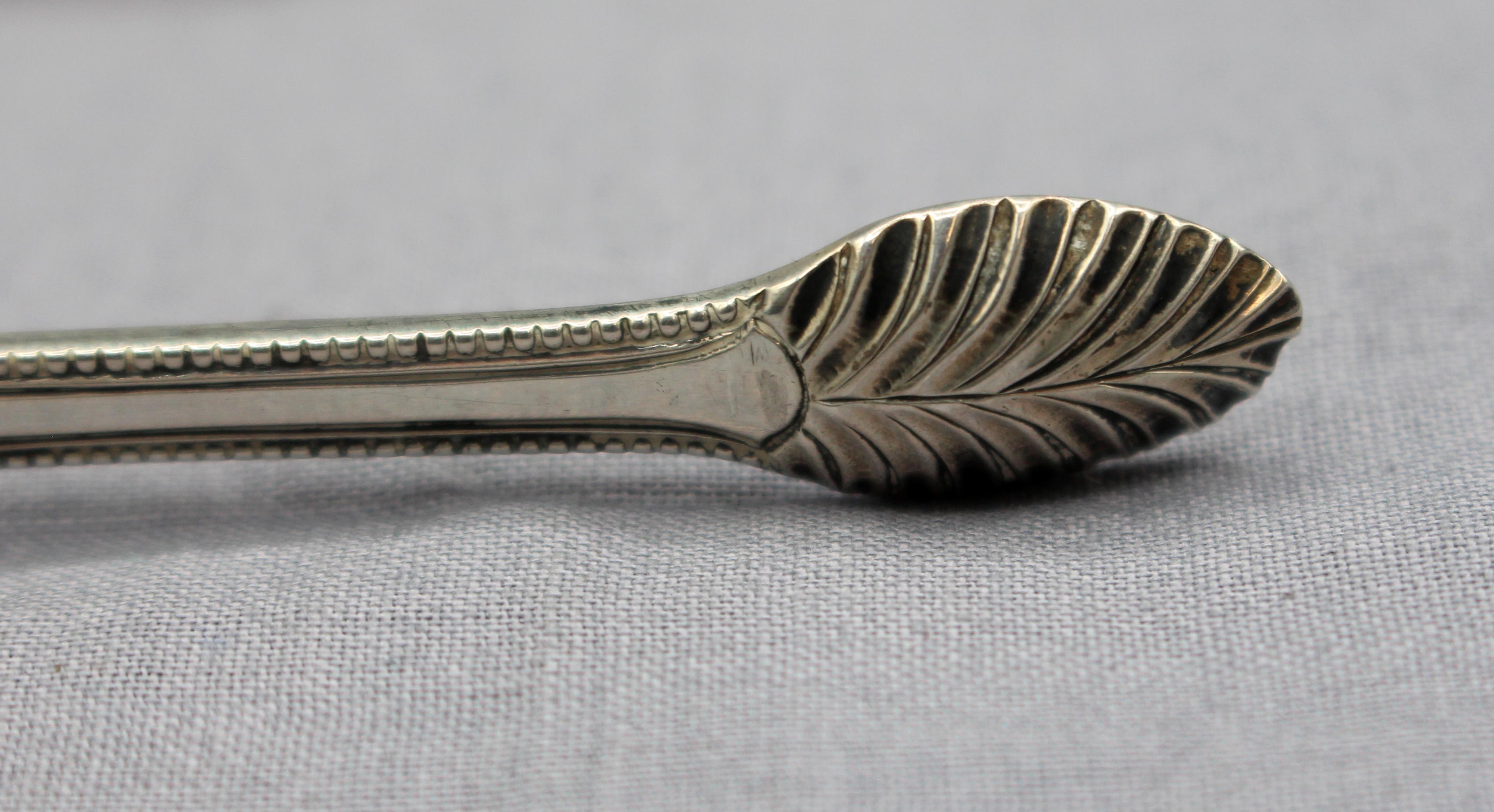 Sterling silver sugar tongs by Richard Crossley, London, 1782-90. Typically only one maker's mark & sterling mark are used. Deep, fine engraving in pure neo-classical taste. Monogram: ML. 1.10 troy oz.
5.5