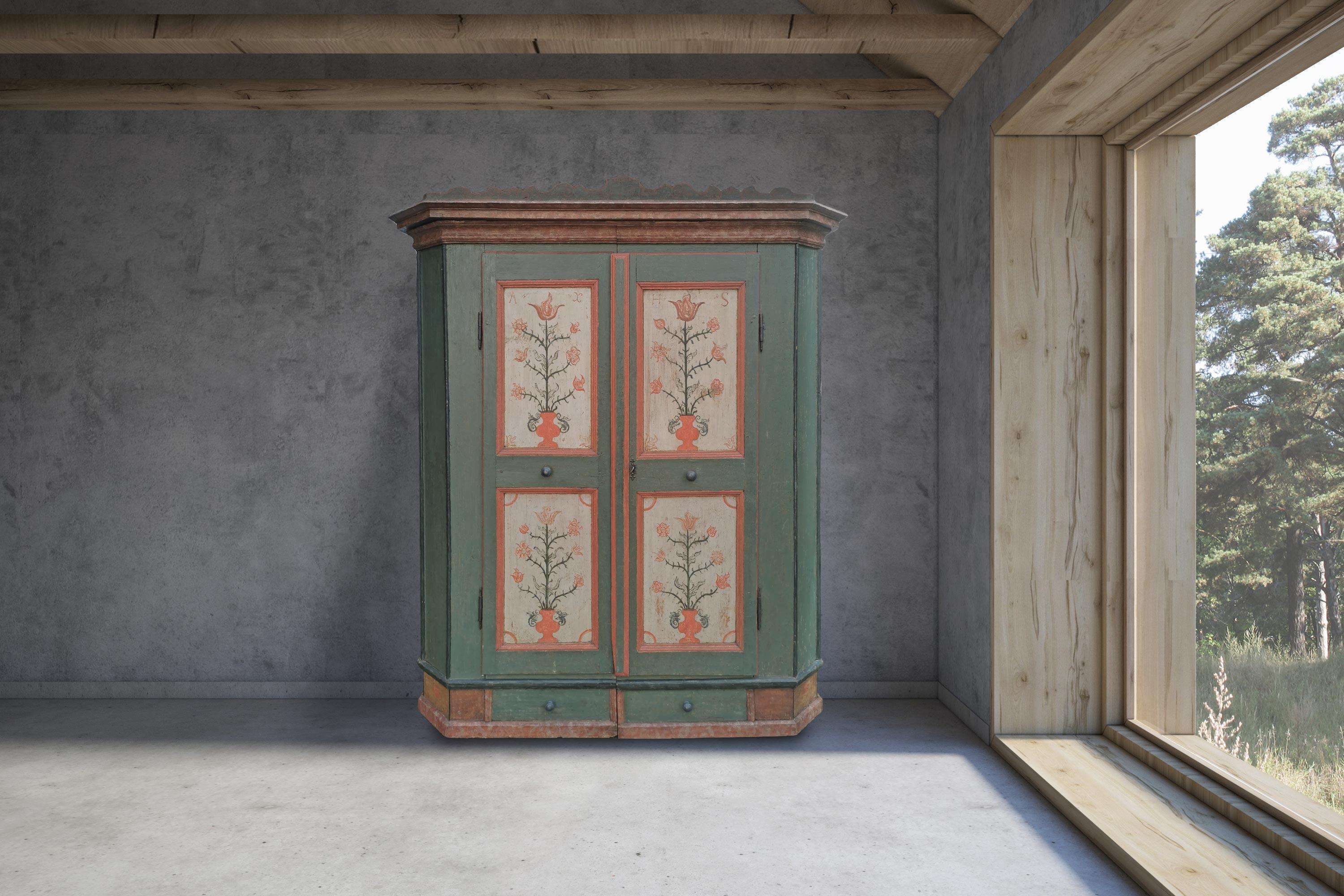 Green Tyrolean wardrobe dated 1782

H.185 – L.142 (160 at the frames) – P.50 (59 at the frames)

Tyrolean painted wardrobe with two doors, entirely painted in intense green.

On the doors, four ivory panels with red frames contain floral