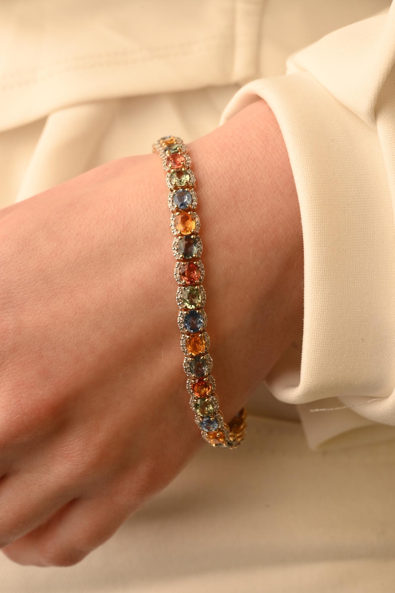 This Beautiful Multi Sapphire Tennis Bracelet with Diamonds in 14K gold showcases 35 endlessly sparkling natural sapphires, weighing 17.85 carats. It measures 7 inches long in length. 
Multi sapphire gemstone releases the strength of creativity and