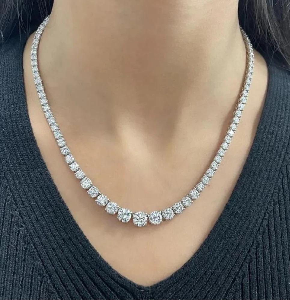 Metal: Platinum
Diamond Shape: Round
Total Carat Weight: 17.89 Cts (1 ct stone in center)
Diamond Color: F-G
Diamond Clarity: SI1-2
Total No. Of Stones: 111 Stones